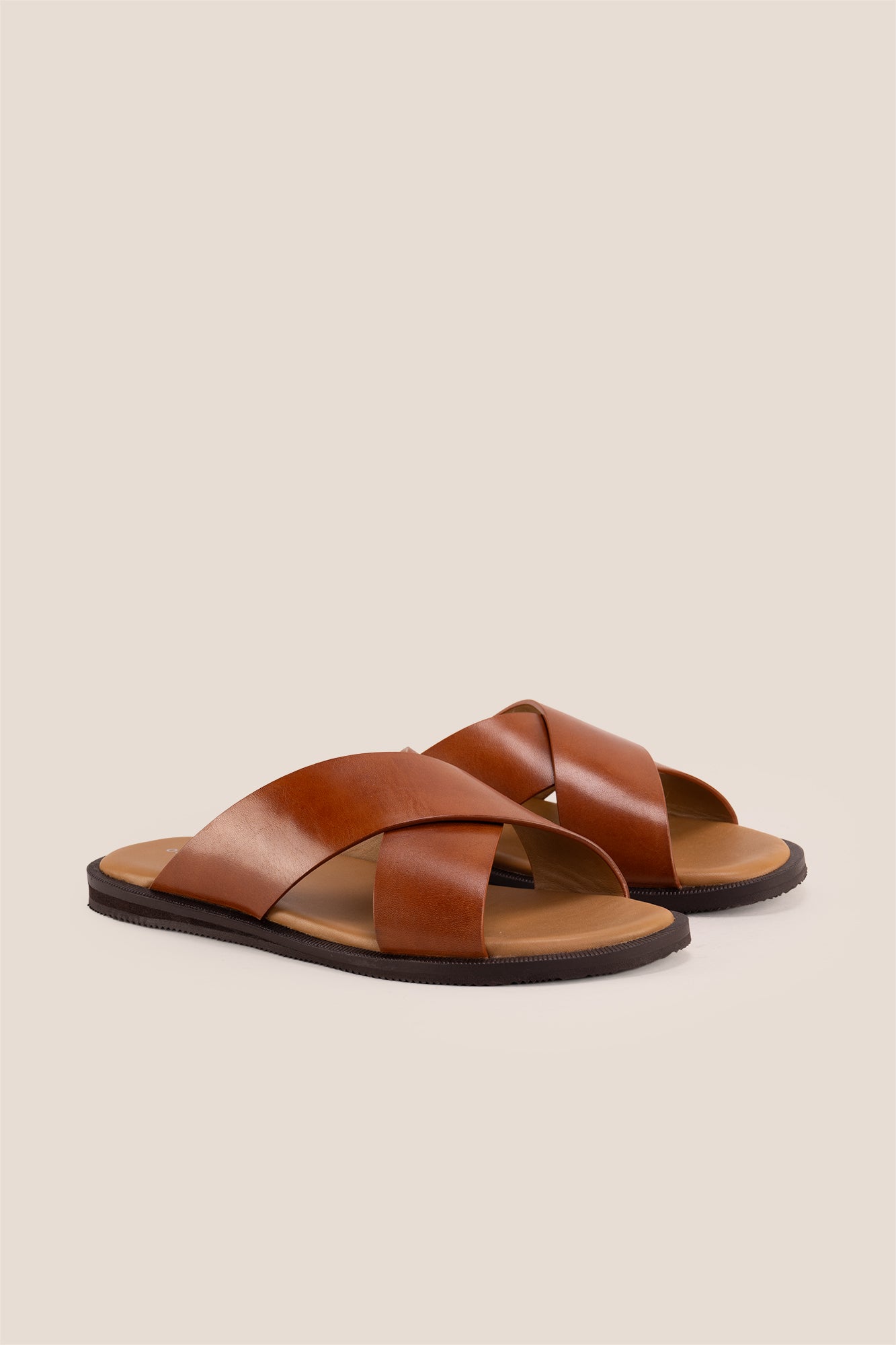 Men’s Ollie Tan sandals featuring a bold, wide criss-cross strap design in smooth high-grade tan leather.