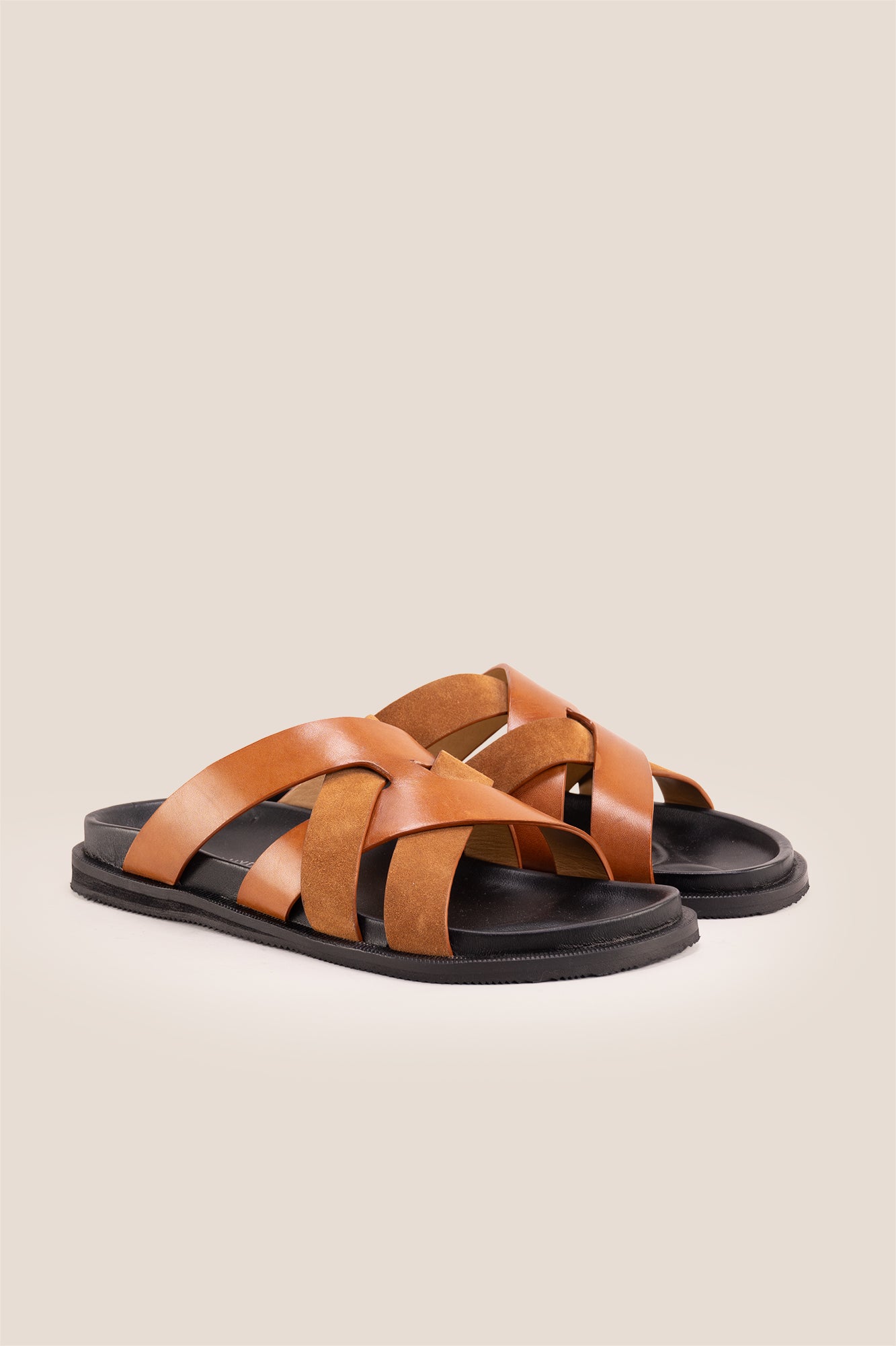 Men’s Rowan Tan slide sandals featuring a soft suede leather X-strap design and an earthy tan finish.