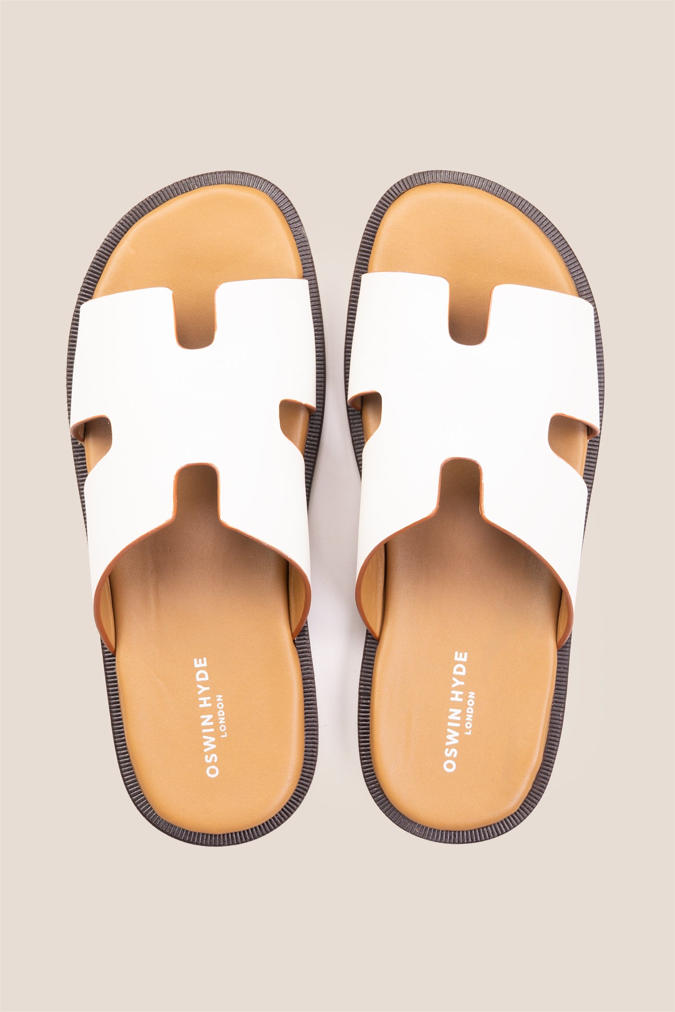 Men’s Phoenix White sandals in premium white leather featuring a minimalist hyde strap H-frame design.