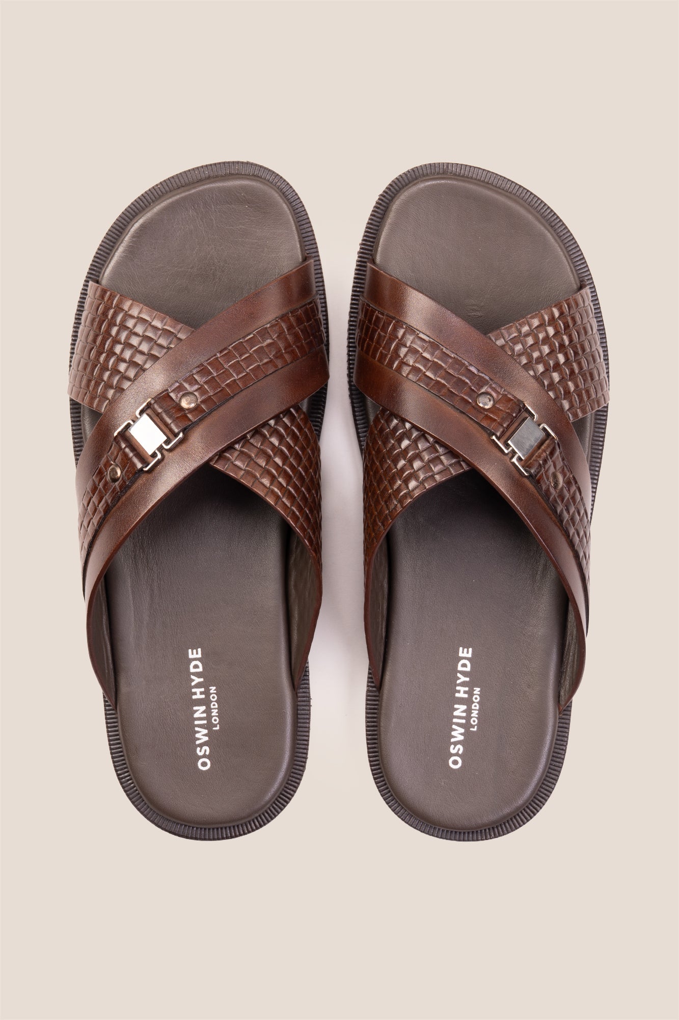 Aiden Brown men’s leather sandals with a unique woven criss-cross strap design.