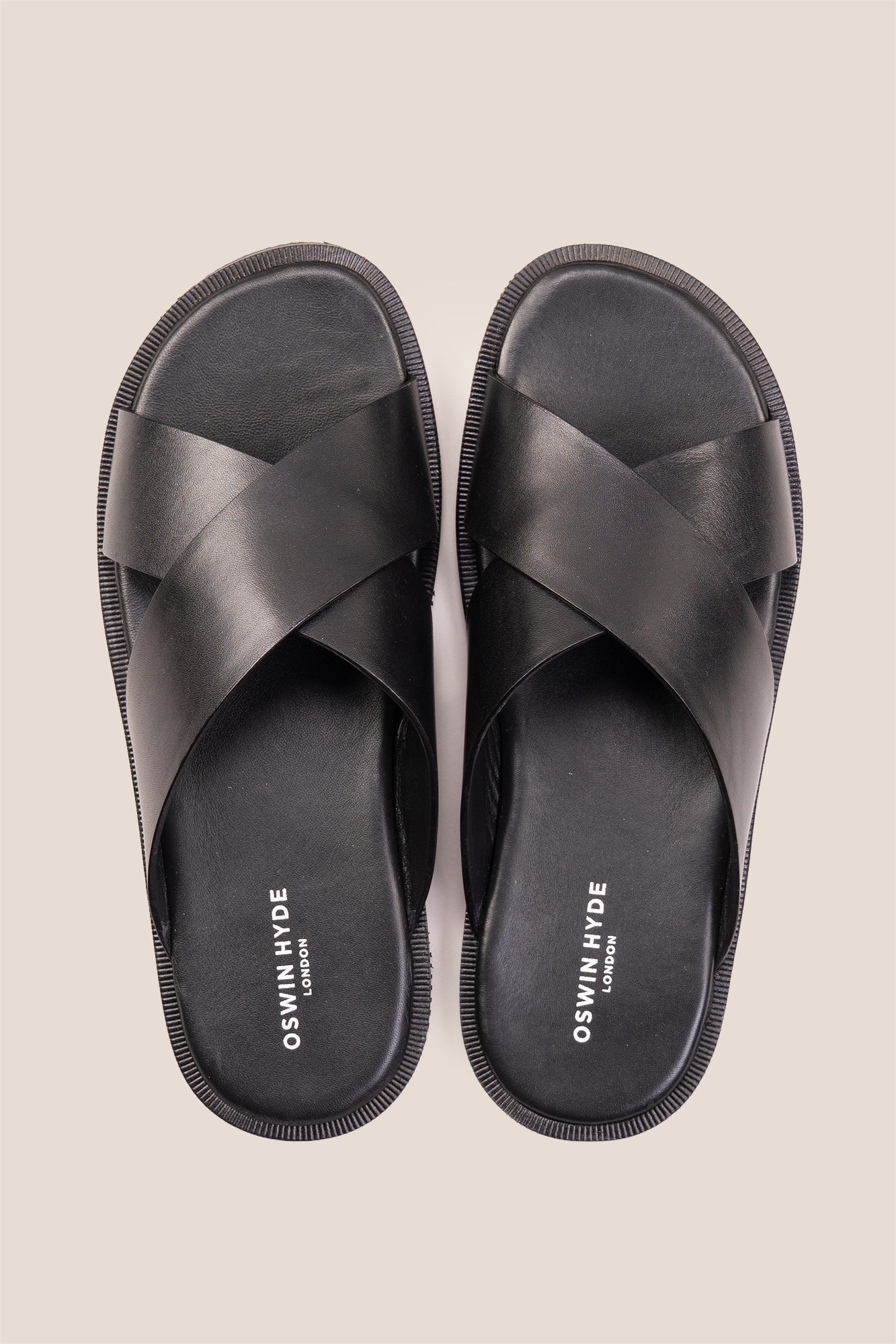 Men’s Ollie Black sandals featuring a bold, wide criss-cross strap design in smooth high-grade tan leather.