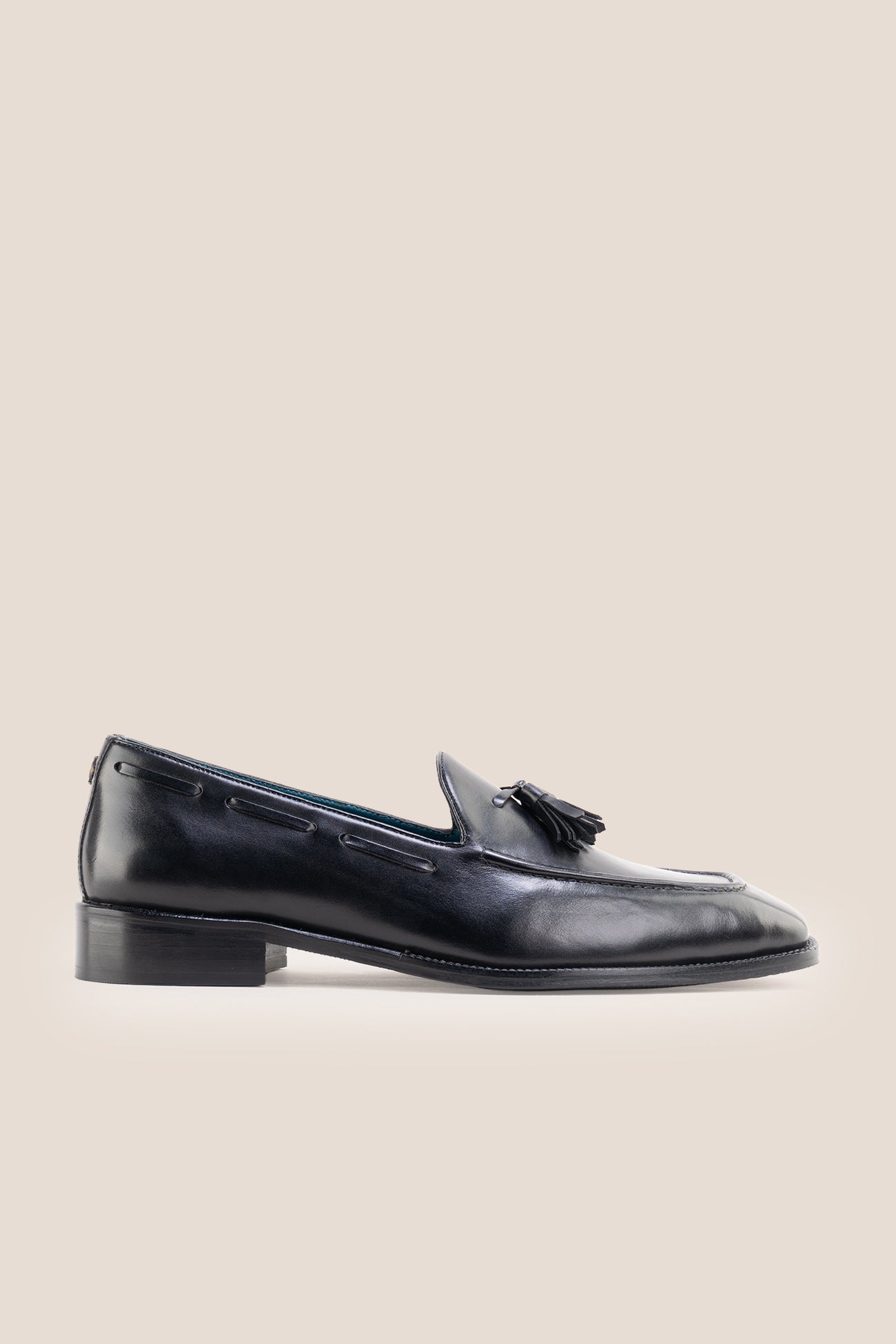 The Emmanuel black tassel loafers feature distinctive hand-stitched tassels and premium full-grain leather, perfect for suits, formal occasions, and elevated casual wear.