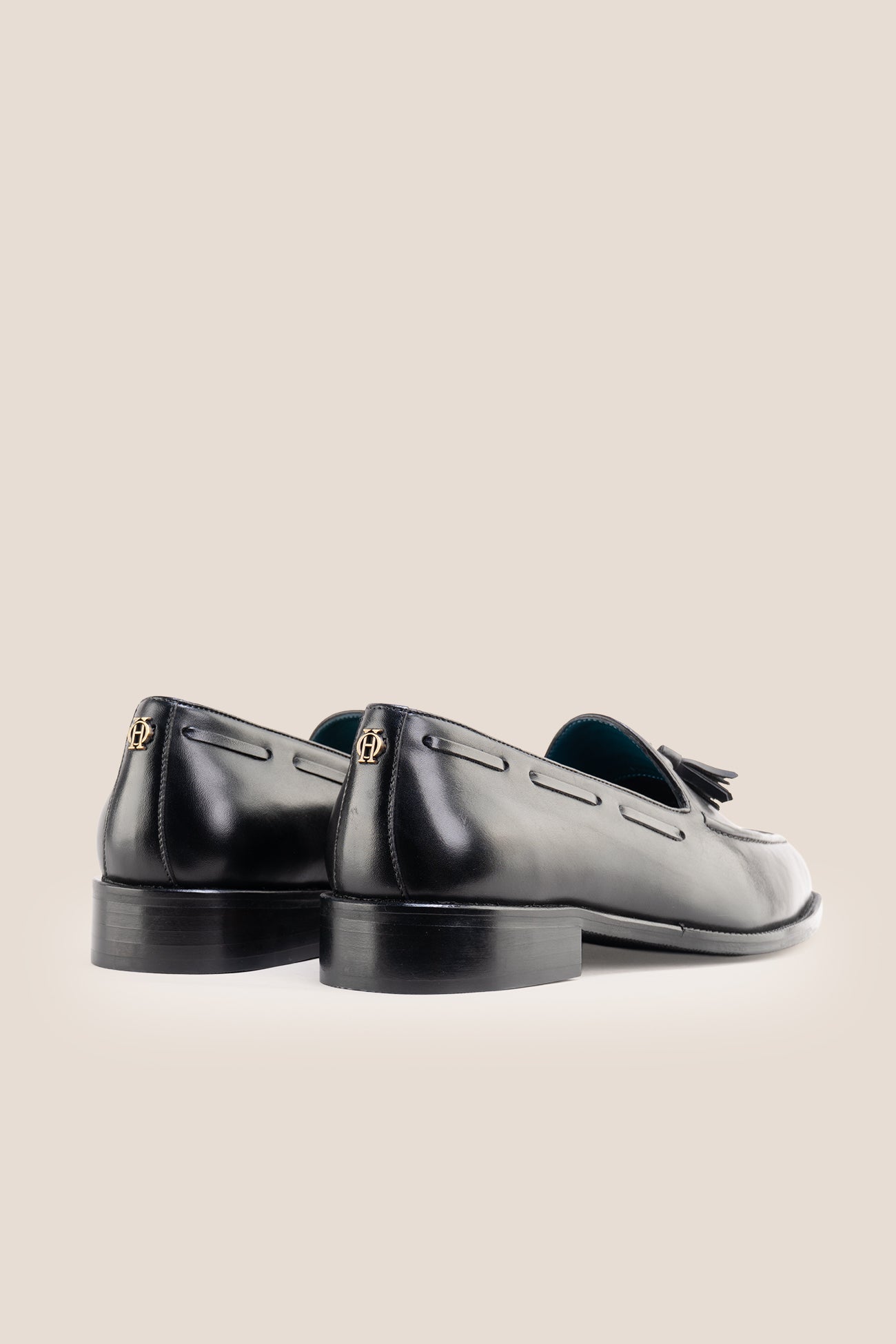 The Emmanuel black tassel loafers feature distinctive hand-stitched tassels and premium full-grain leather, perfect for suits, formal occasions, and elevated casual wear.