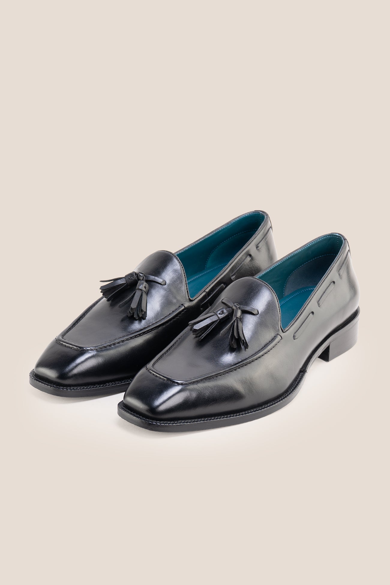 The Emmanuel black tassel loafers feature distinctive hand-stitched tassels and premium full-grain leather, perfect for suits, formal occasions, and elevated casual wear.