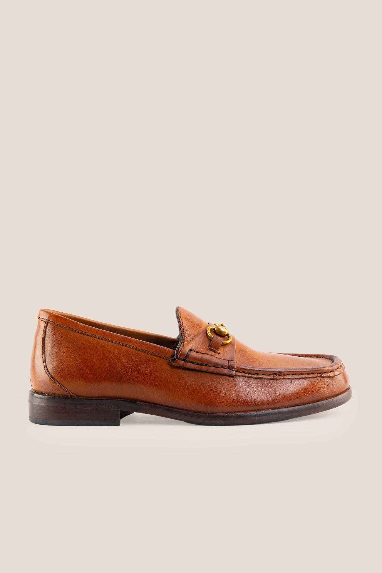 Pair of Oswin Hyde Samuel Tan leather horsebit loafers featuring gold bit hardware.