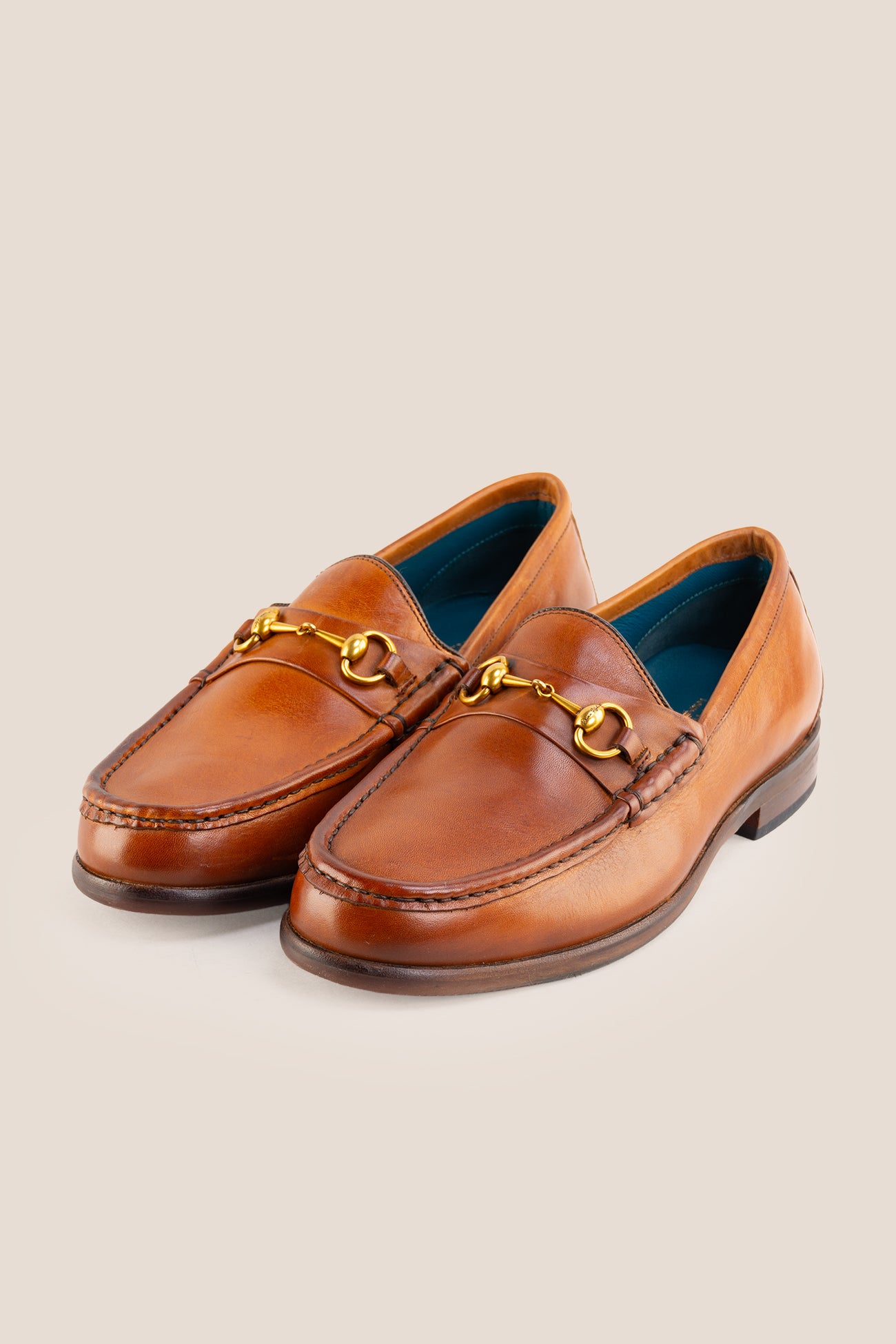 Pair of Oswin Hyde Samuel Tan leather horsebit loafers featuring gold bit hardware.