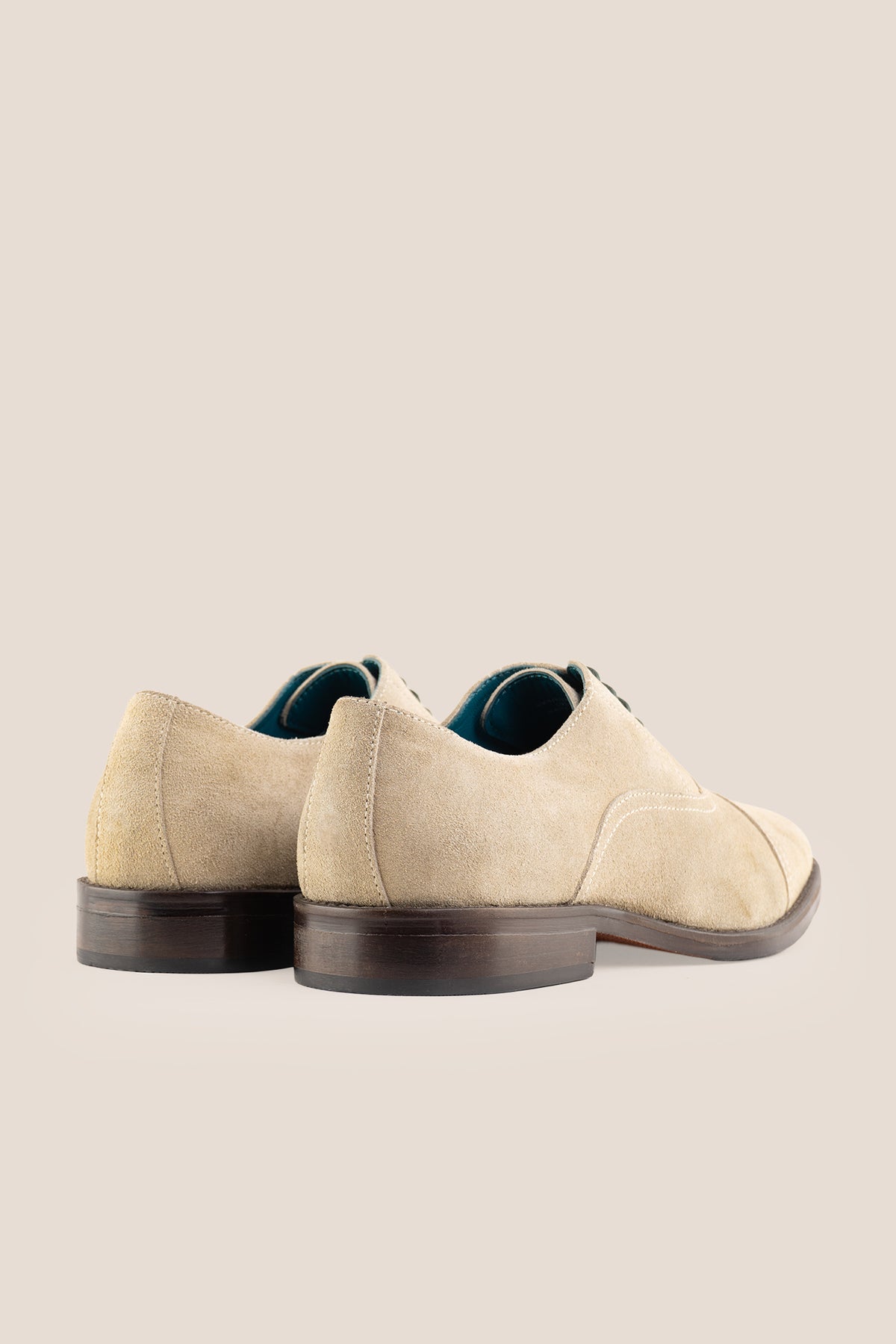 Model wearing Elise Sand men's sand suede Oxford shoes