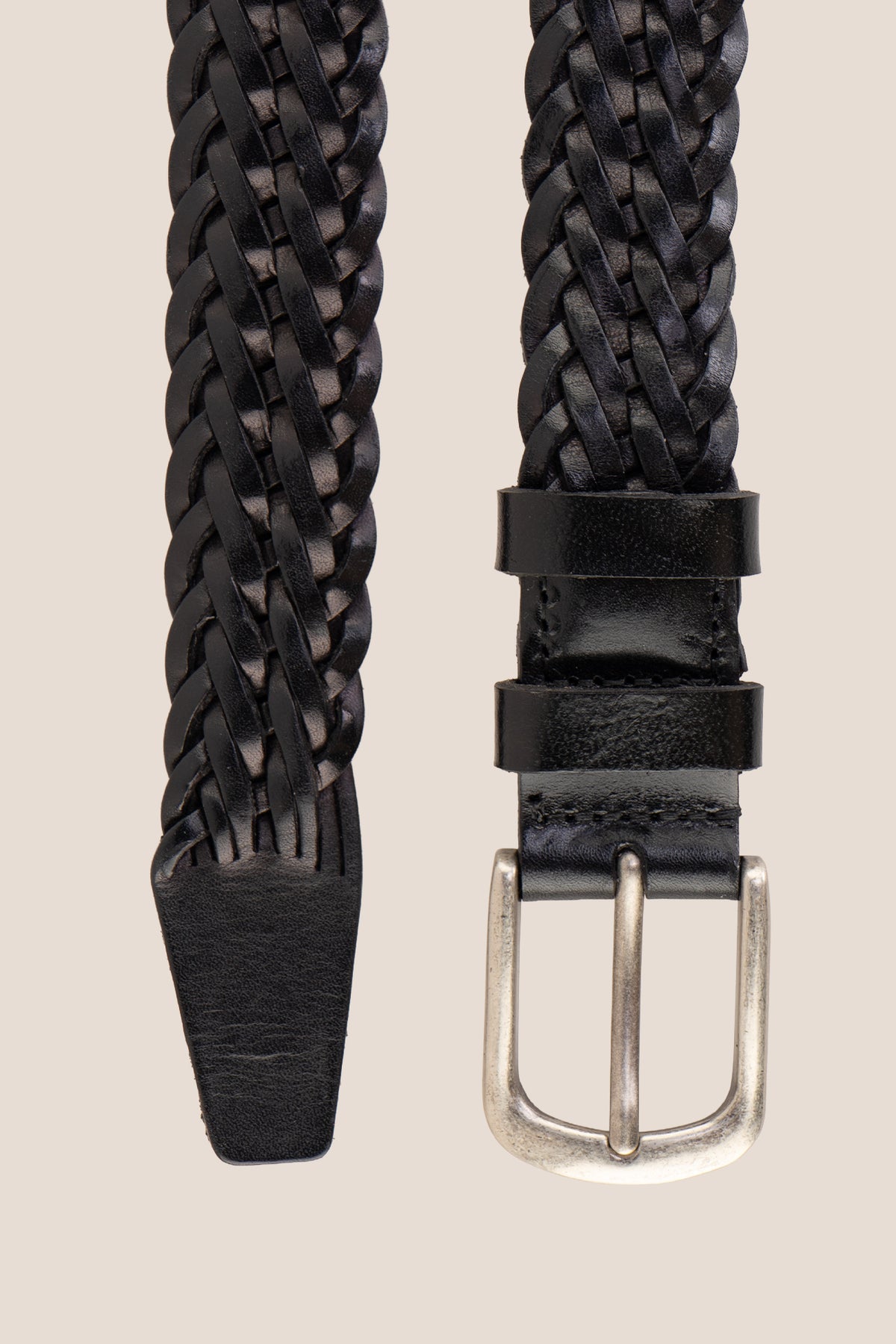 Milo black braided leather belt with brushed silver buckle on neutral background