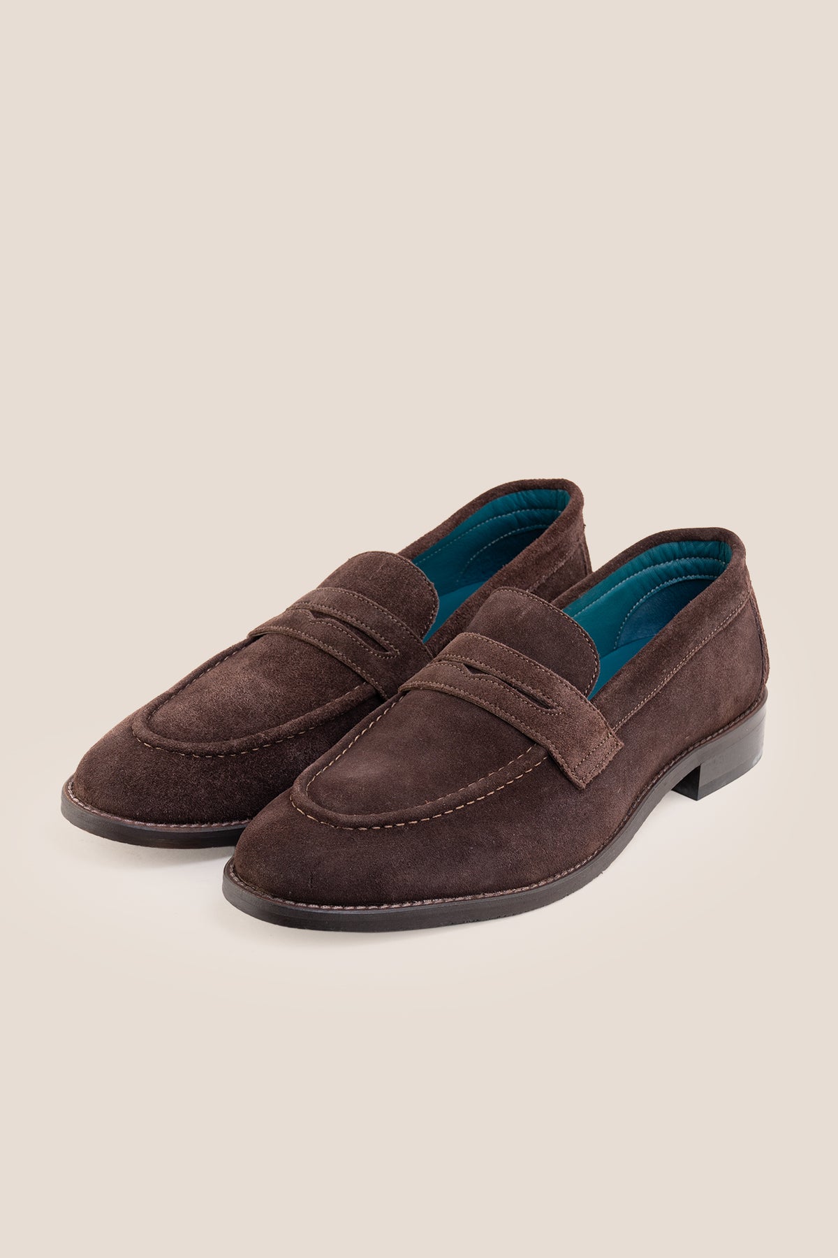 Men's Wyatt Brown Suede penny loafers crafted from premium crust suede leather with a classic slip-on design.