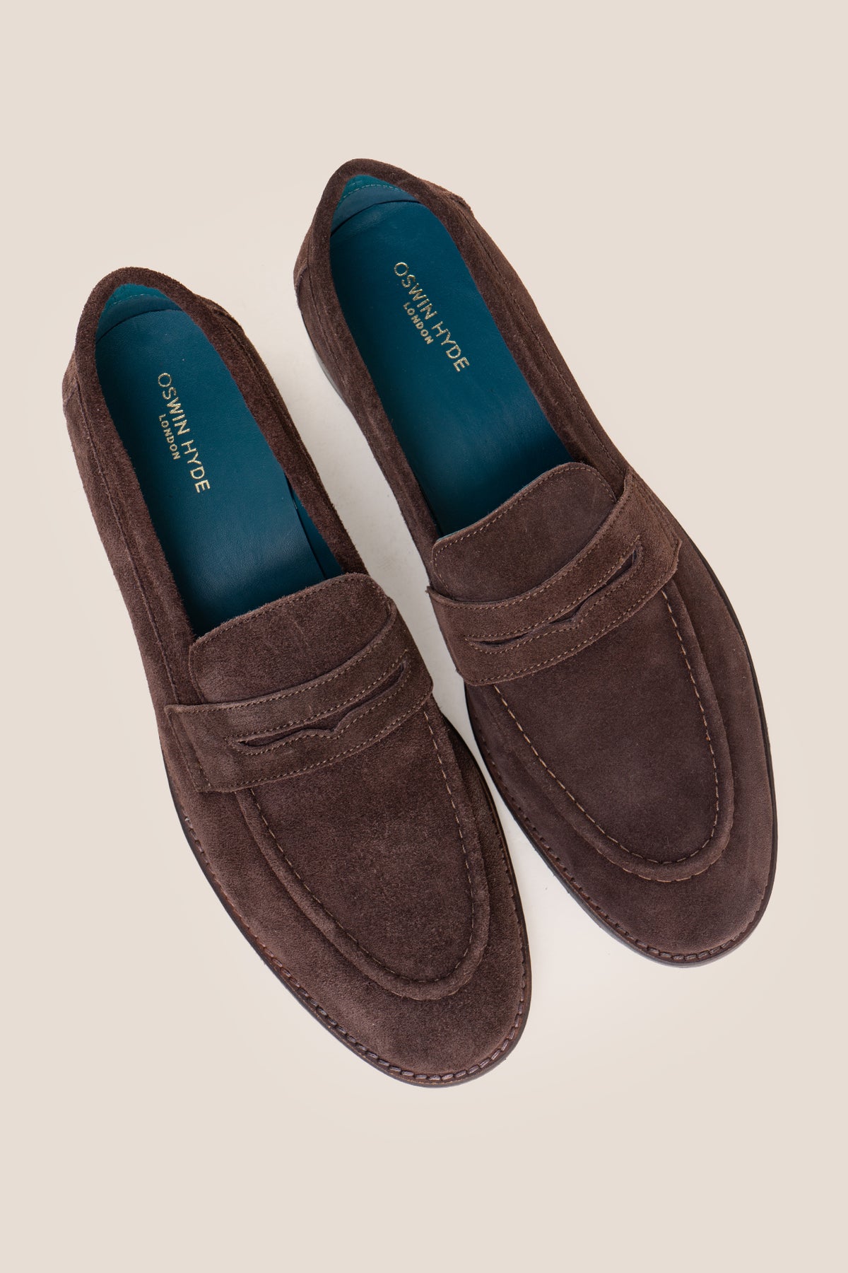 Men's Wyatt Brown Suede penny loafers crafted from premium crust suede leather with a classic slip-on design.