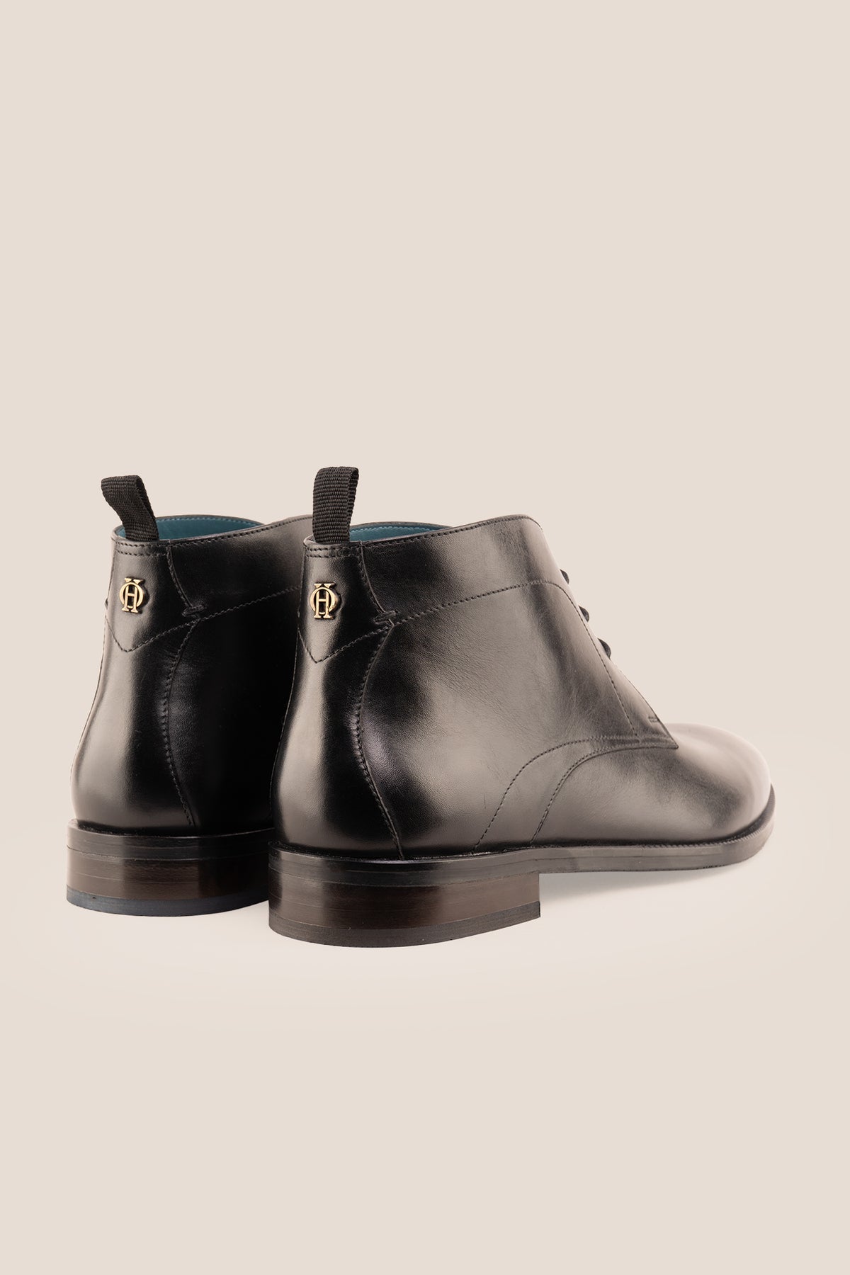 Men's Franklin Black leather lace-up ankle boots by Oswin Hyde featuring a polished black finish and sturdy heel.