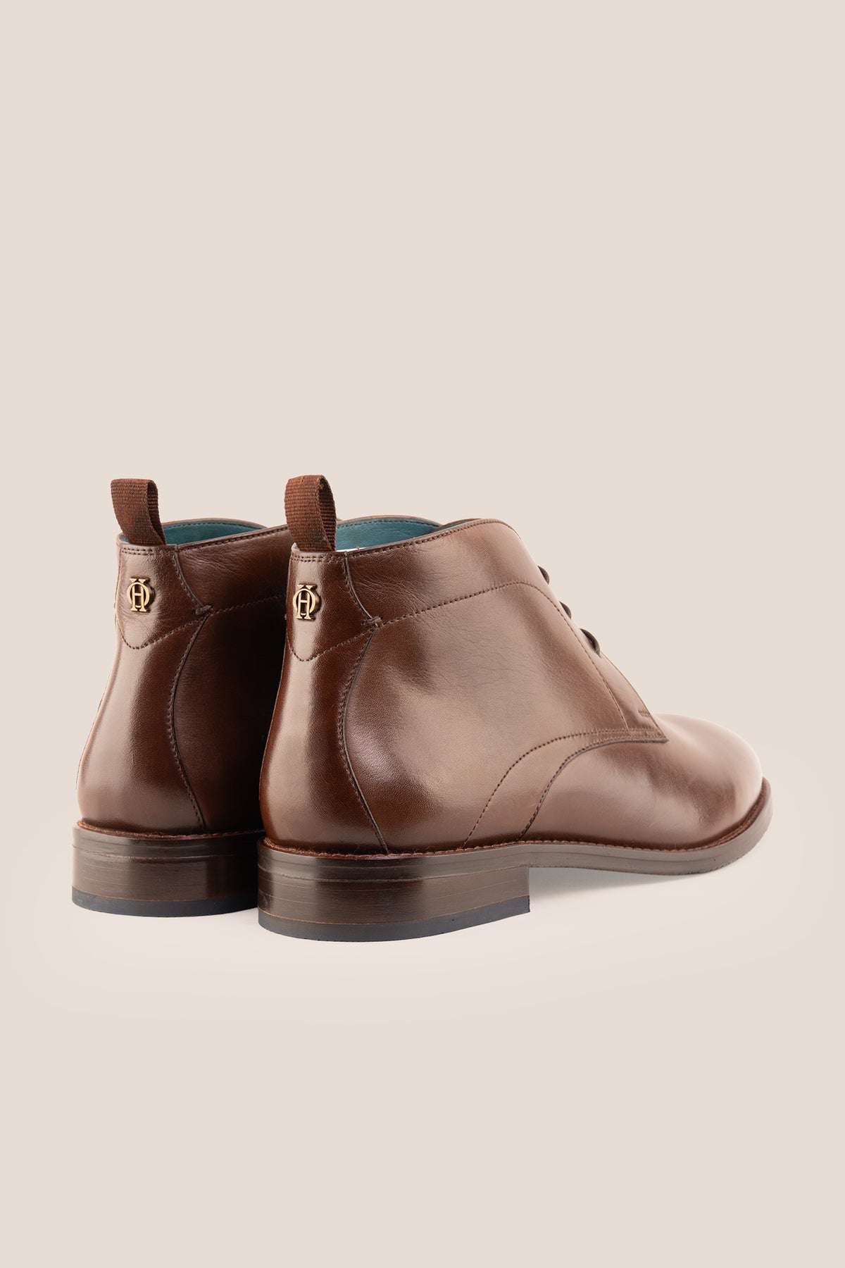 Men's Franklin Brown leather lace-up ankle boots by Oswin Hyde featuring a polished chestnut leather finish and sturdy heel.