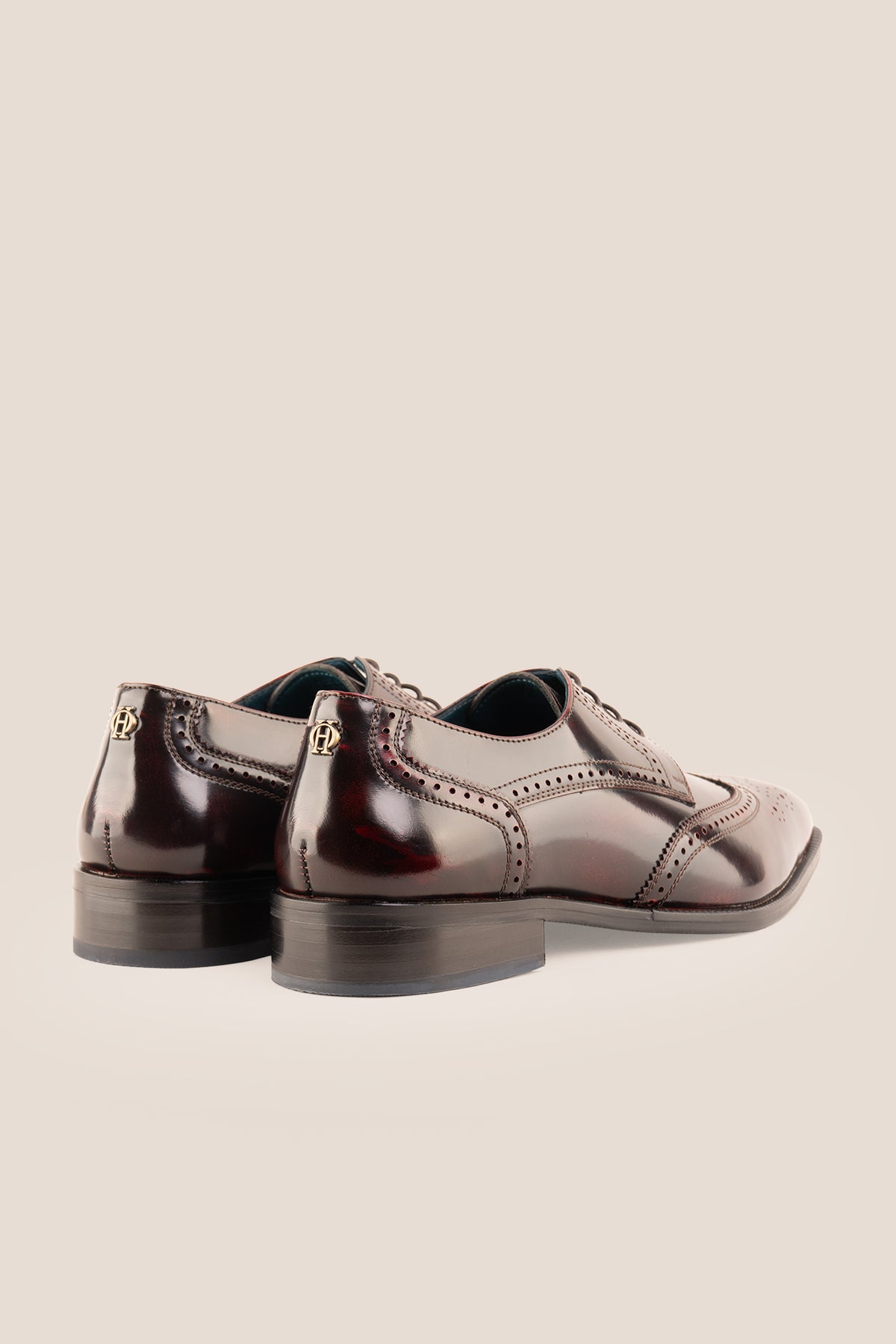 Men's Gabriel Bordo leather wingtip Derby dress shoes by Oswin Hyde featuring rich burgundy leather and lace-up closure.