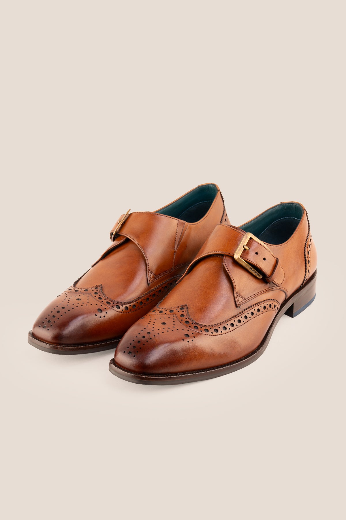 Men's Godric Tan leather monk strap brogue dress shoes by Oswin Hyde featuring burnished tan leather and a buckle strap.