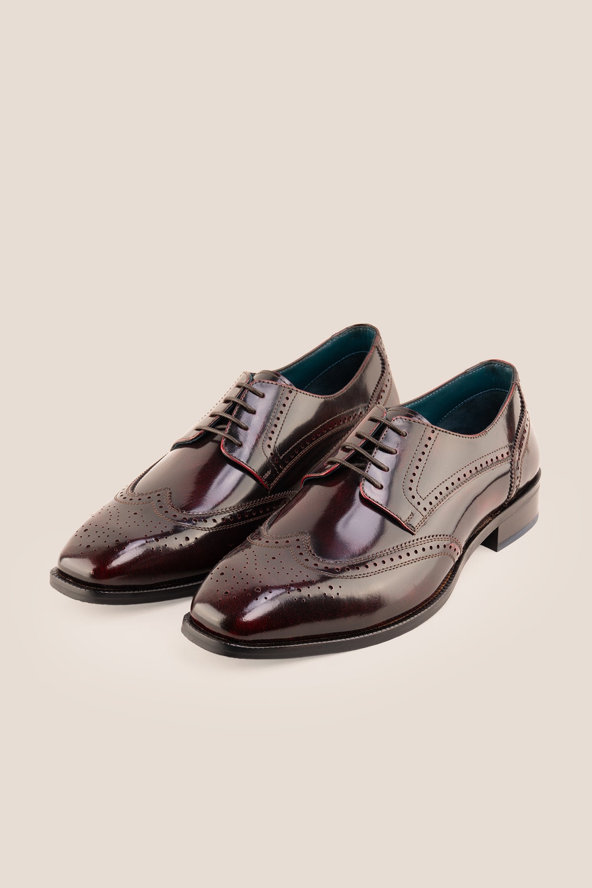 Men's Gabriel Bordo leather wingtip Derby dress shoes by Oswin Hyde featuring rich burgundy leather and lace-up closure.