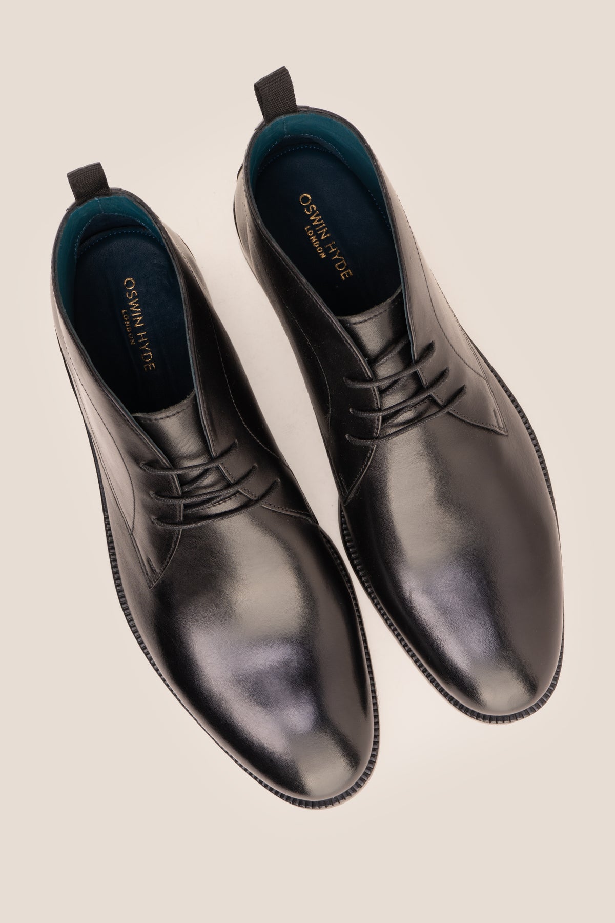 Men's Franklin Black leather lace-up ankle boots by Oswin Hyde featuring a polished black finish and sturdy heel.