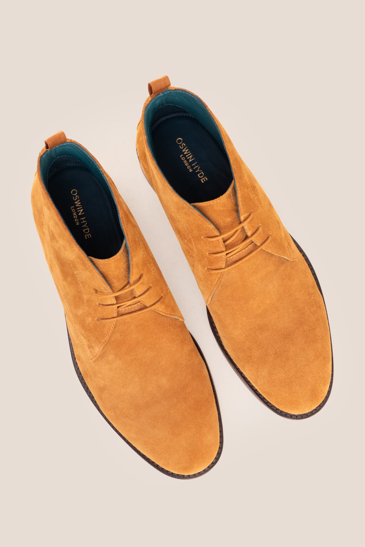 Men's Franklin Tan Suede lace-up ankle boots by Oswin Hyde featuring a soft sand suede finish and sturdy heel.
