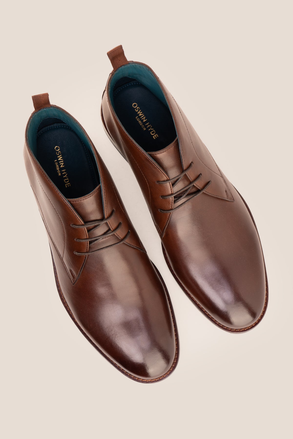 Men's Franklin Brown leather lace-up ankle boots by Oswin Hyde featuring a polished chestnut leather finish and sturdy heel.