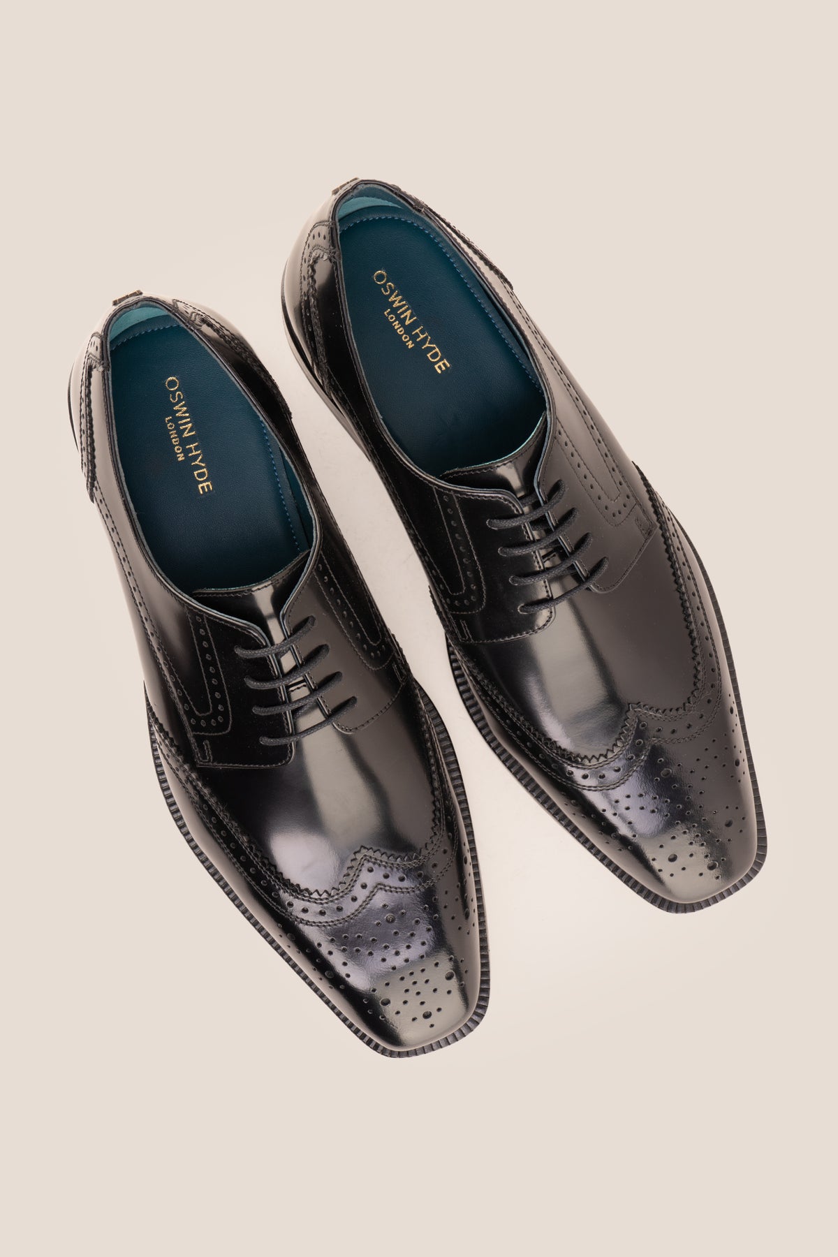 Men's Gabriel Black leather wingtip Derby dress shoes by Oswin Hyde featuring high-shine black leather and lace-up closure.