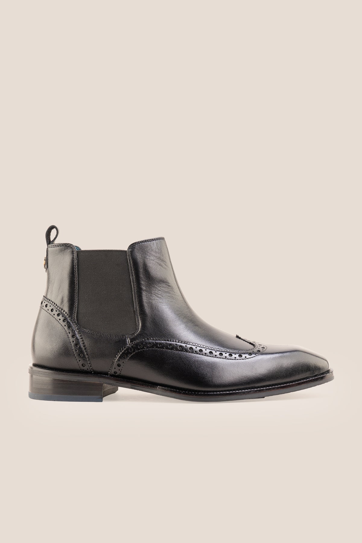 Men's Edgar Black leather brogue Chelsea boots by Oswin Hyde featuring wingtip detailing and elastic side gussets.