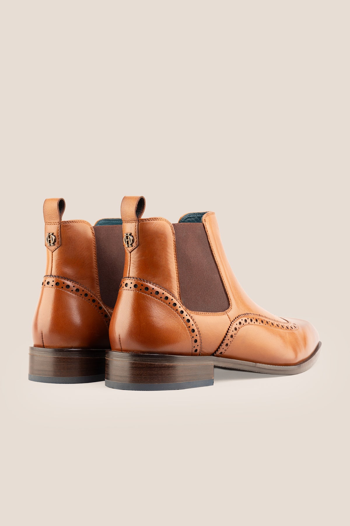 Men's Edgar Tan leather brogue Chelsea boots by Oswin Hyde featuring wingtip detailing and elastic side gussets.