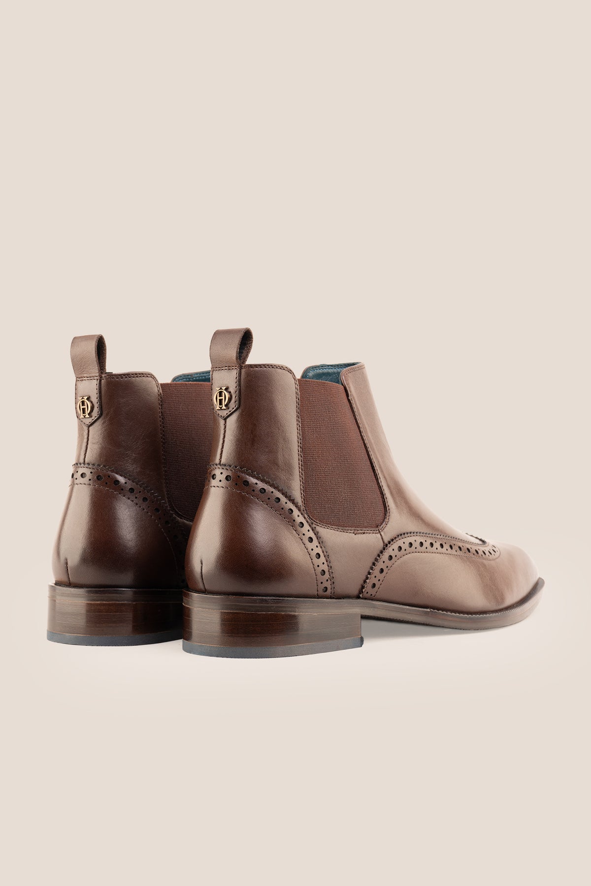 Men's Edgar Brown leather brogue Chelsea boots by Oswin Hyde featuring wingtip detailing and elastic side gussets.