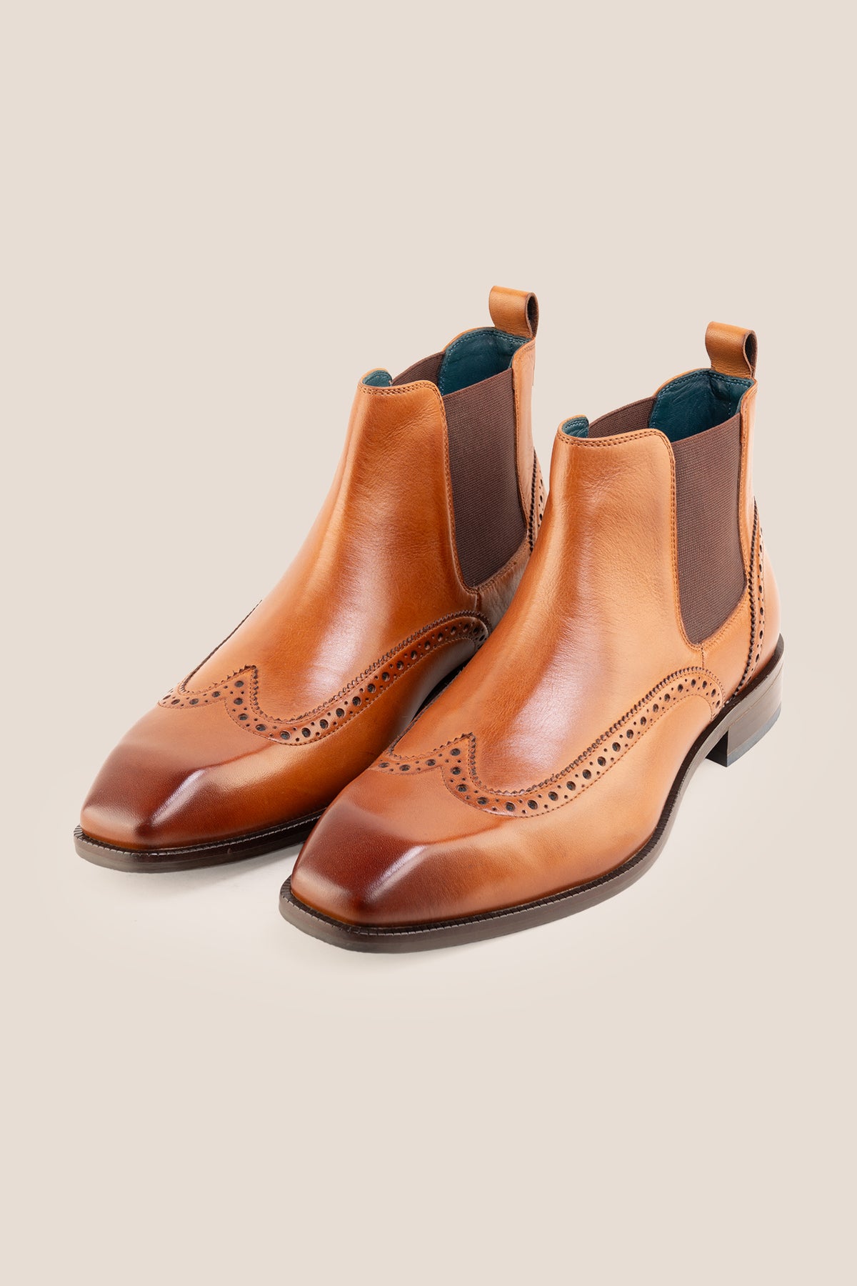 Men's Edgar Tan leather brogue Chelsea boots by Oswin Hyde featuring wingtip detailing and elastic side gussets.