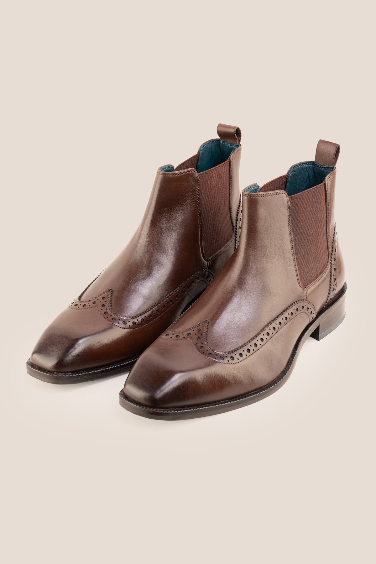 Men's Edgar Brown leather brogue Chelsea boots by Oswin Hyde featuring wingtip detailing and elastic side gussets.