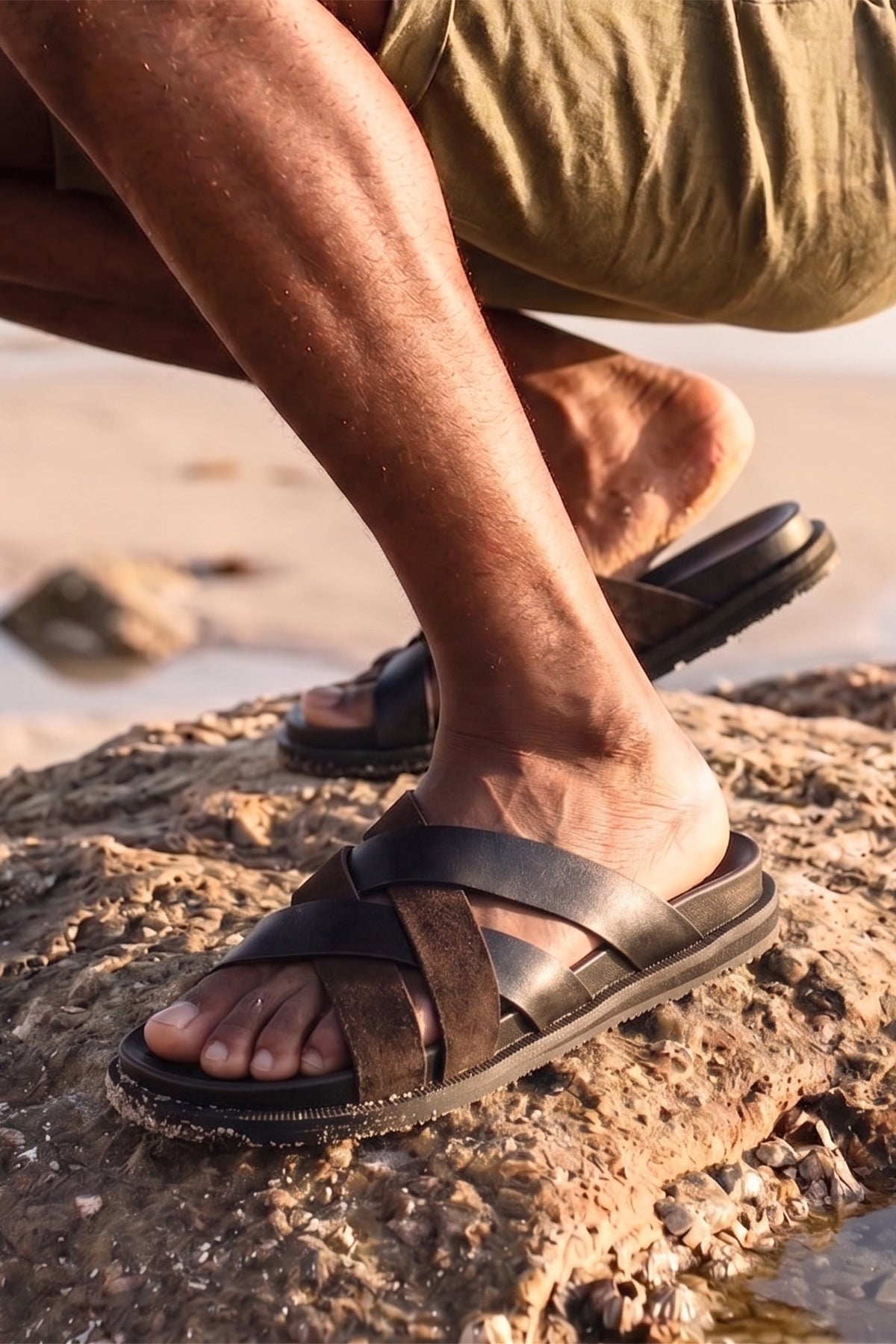 Men’s Rowan Brown slide sandals featuring a textured brown suede X-strap design and a cushioned sole.