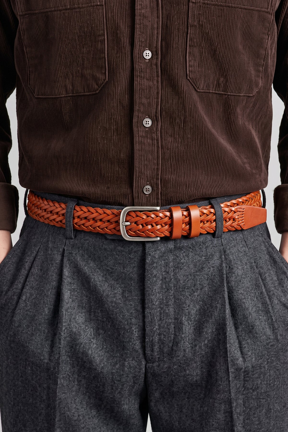 Side profile view of the Milo tan braided leather belt.