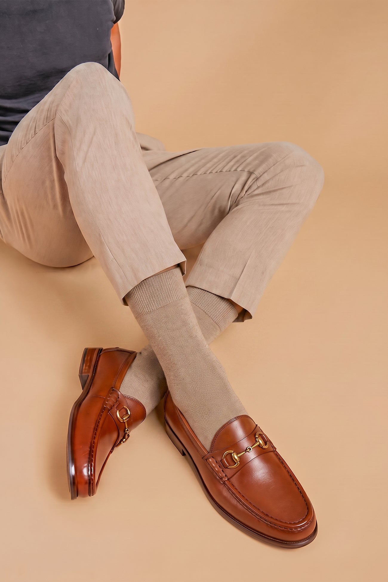 Pair of Oswin Hyde Samuel Tan leather horsebit loafers featuring gold bit hardware.