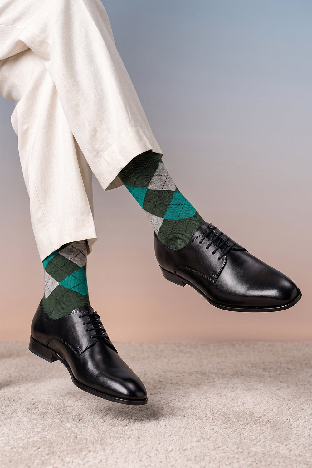 Model wearing Premium cotton bold argyle socks designed by Oswin Hyde for the discerning gentleman.