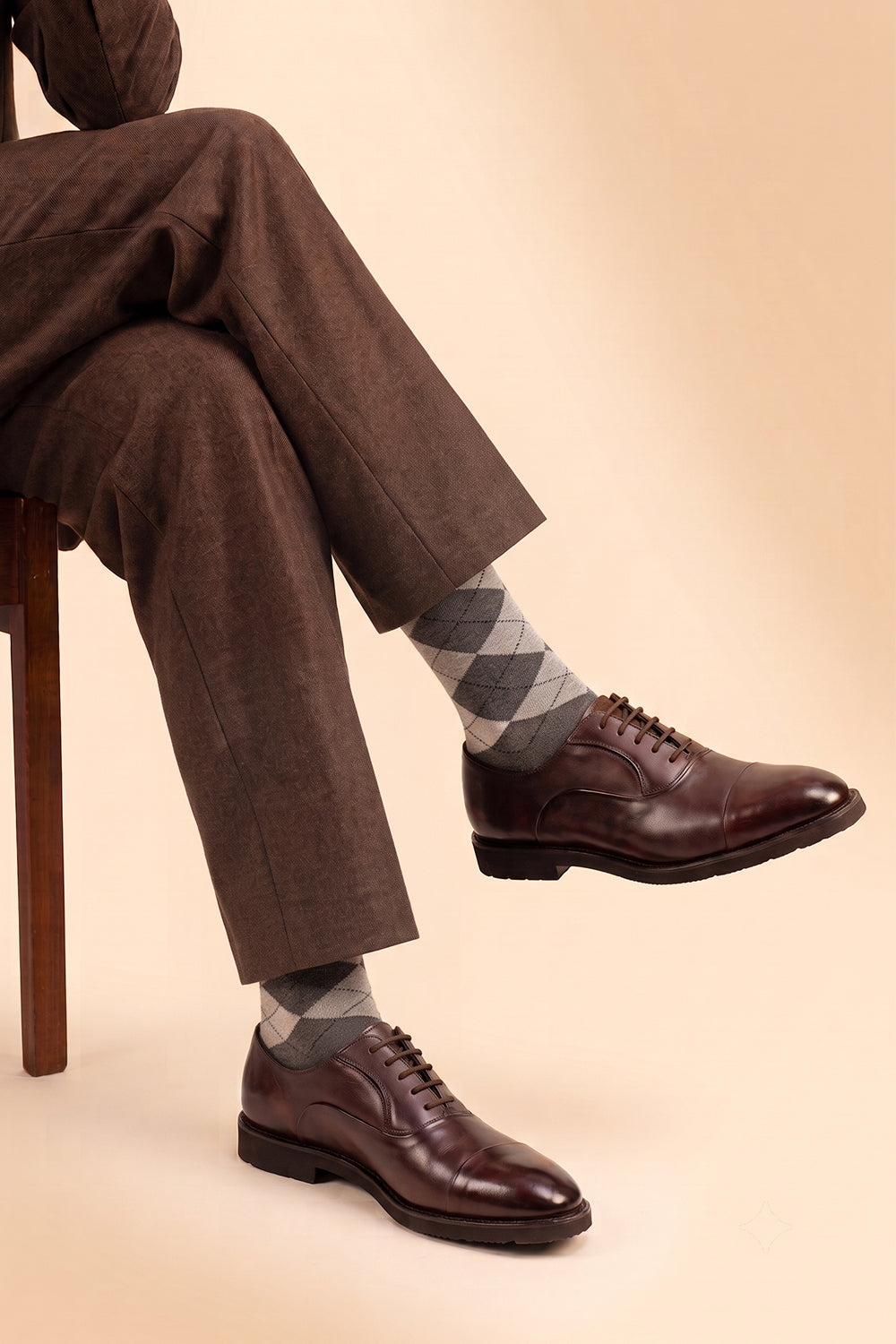 Model wearing Premium cotton scotch argyle socks designed by Oswin Hyde for the discerning gentleman.