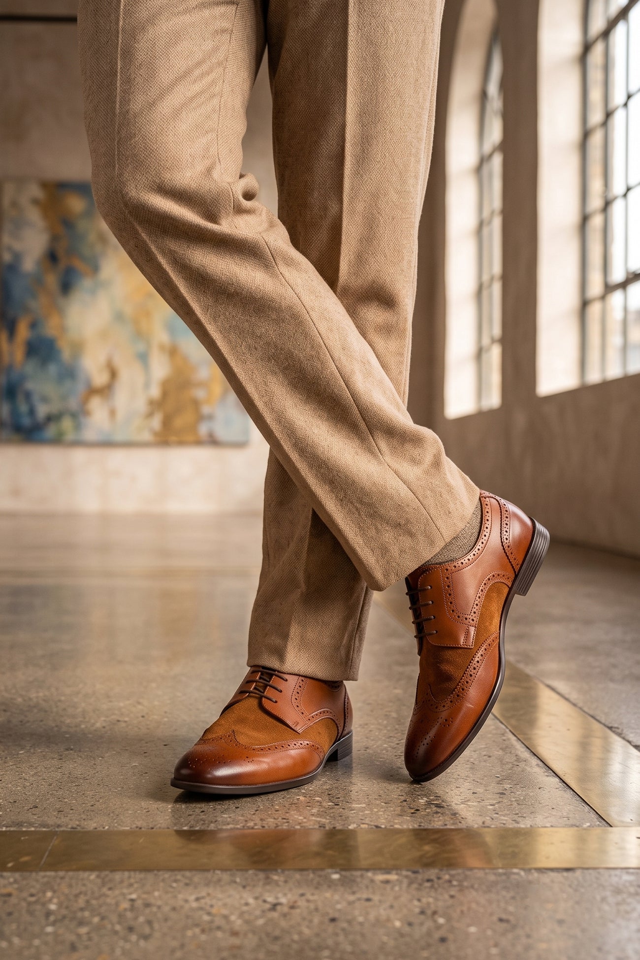 Model wearing Miller Tan Suede men’s leather and suede brogue shoes with wingtip detailing.