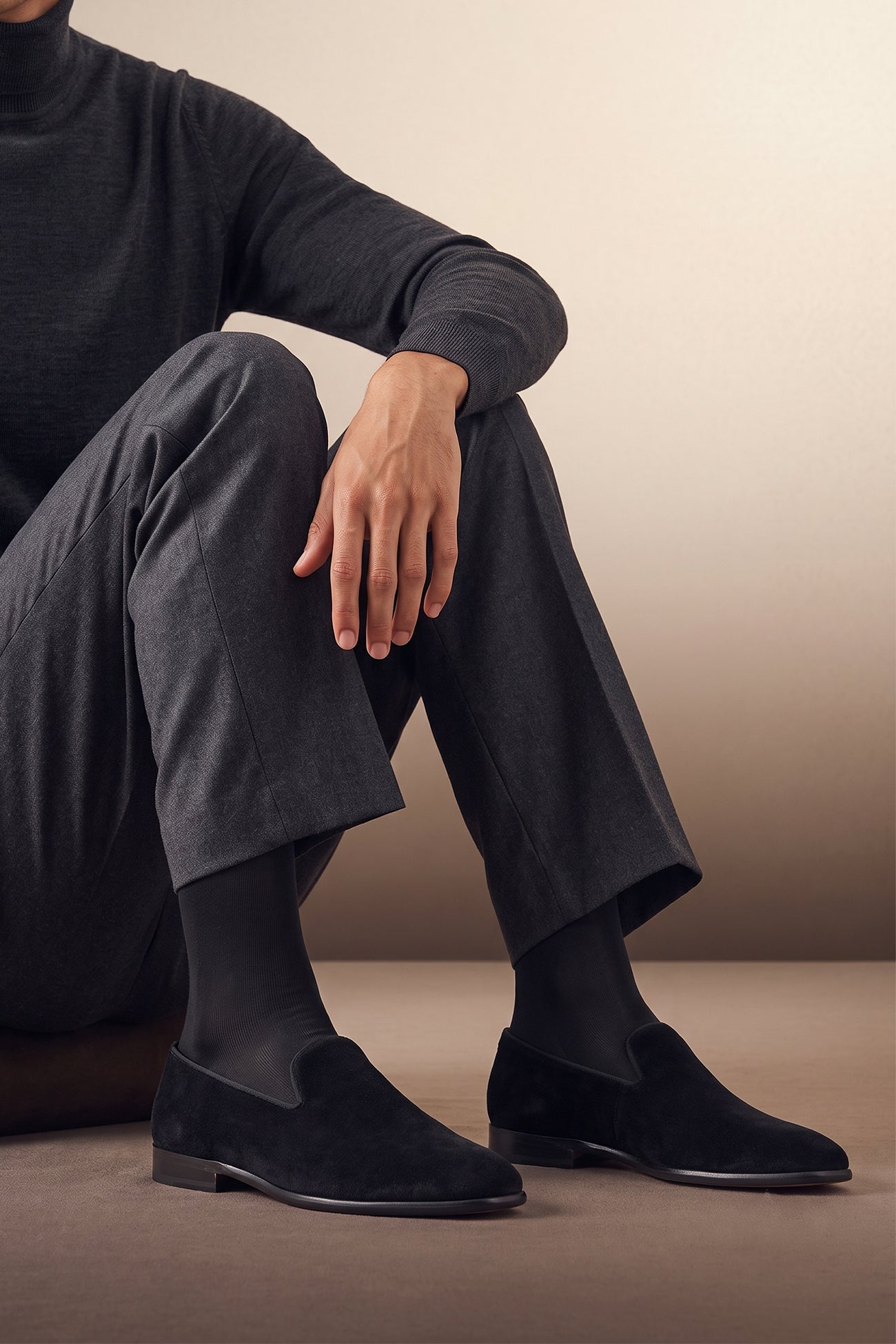 Man wearing Men's black velvet smoking loafers, the Fraser Black, slip-on dress shoes for black-tie and formal events.