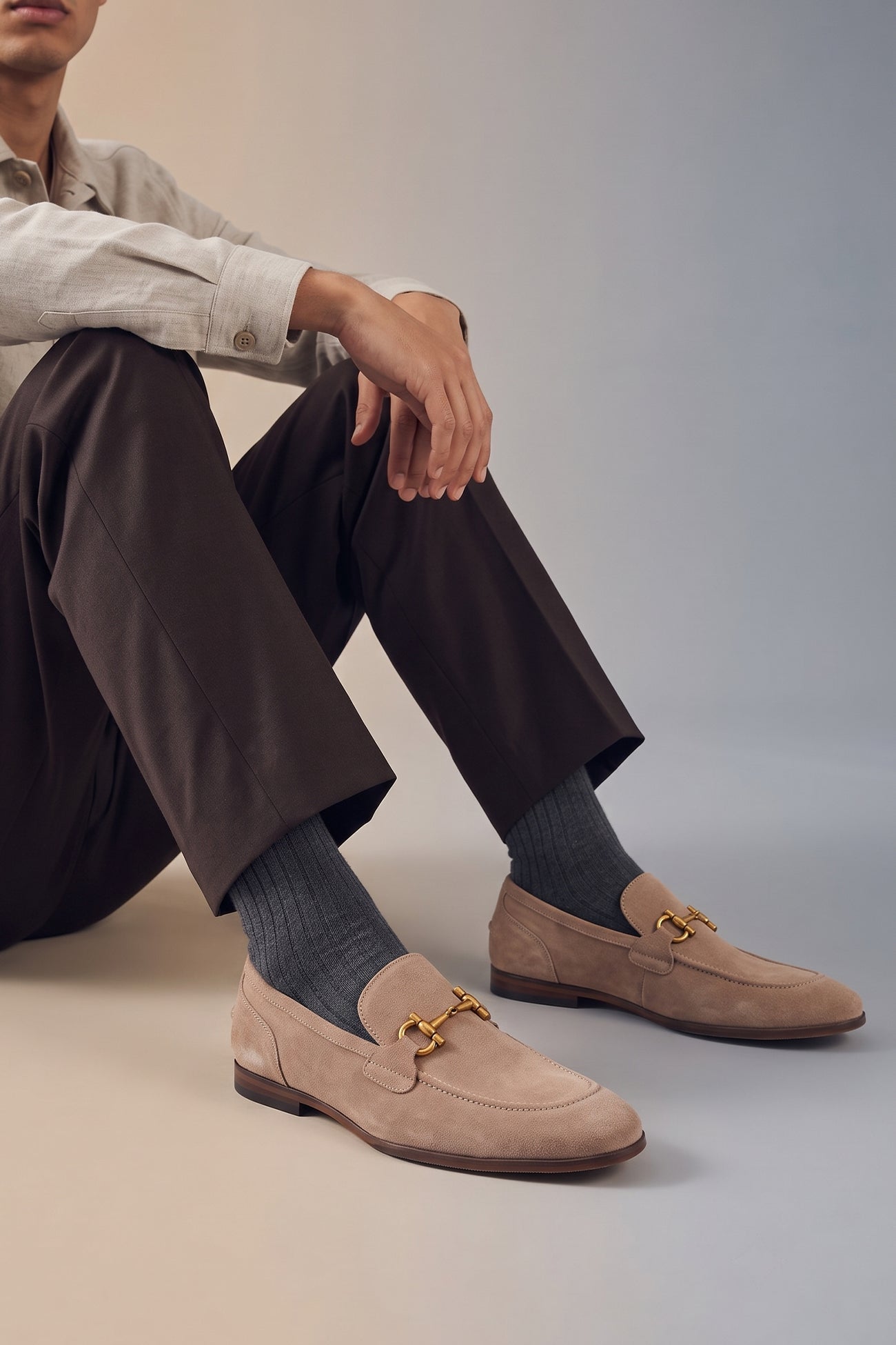 Man wearing Horsebit men's Sand Suede Premium Loafers by Oswin Hyde with contemporary design and comfort.