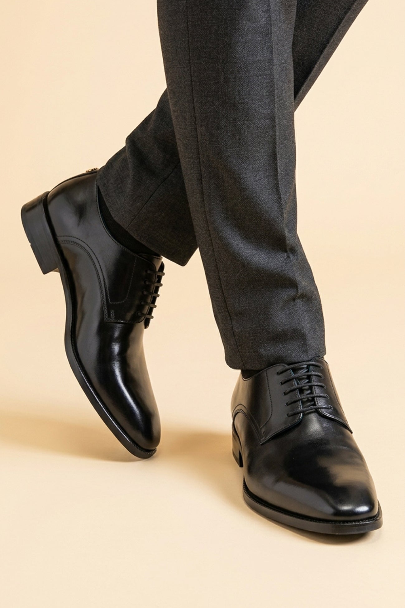 The men's smart black shoes combine timeless elegance with open-lacing comfort, perfect for business tailoring and formal events.