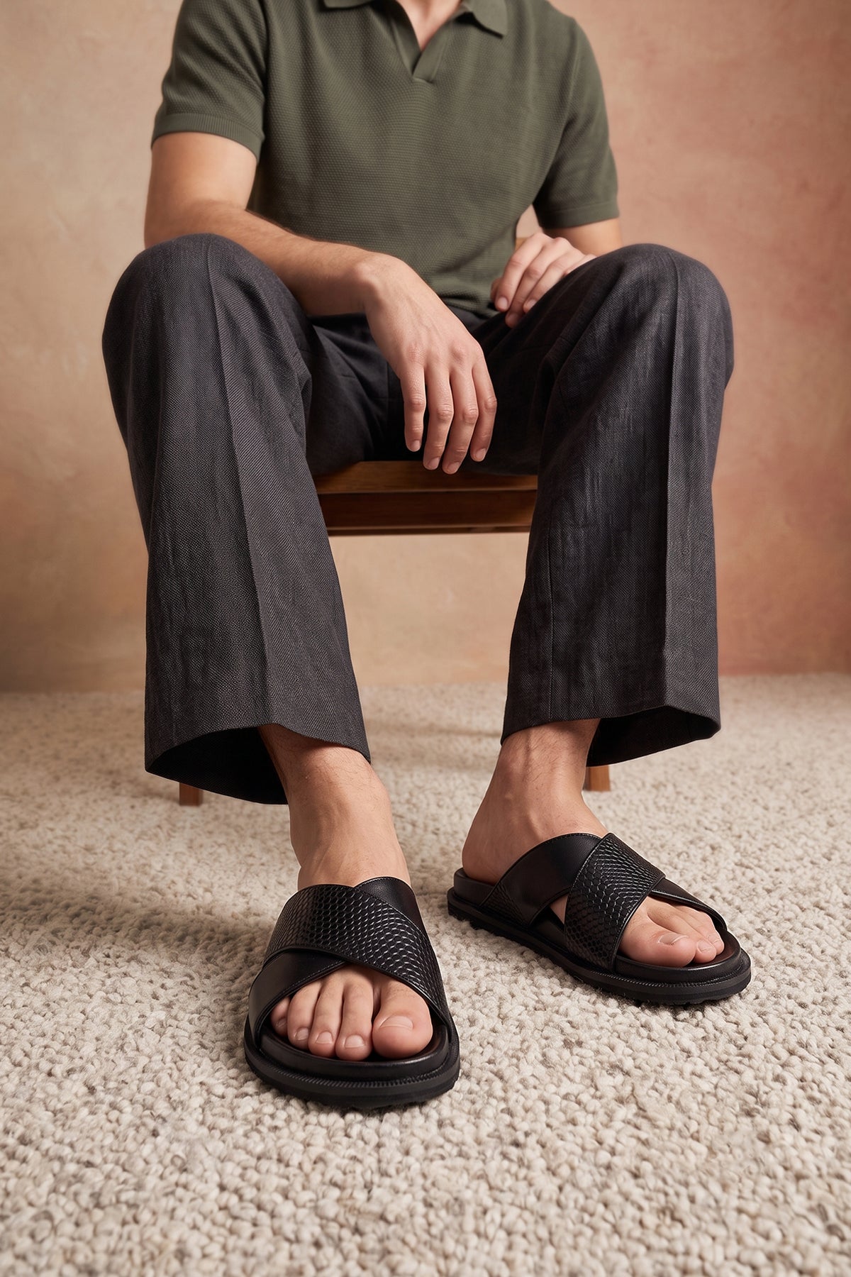 Man wearing Nyle Black cross strap sandals for men by Oswin Hyde with sleek design and comfortable fit