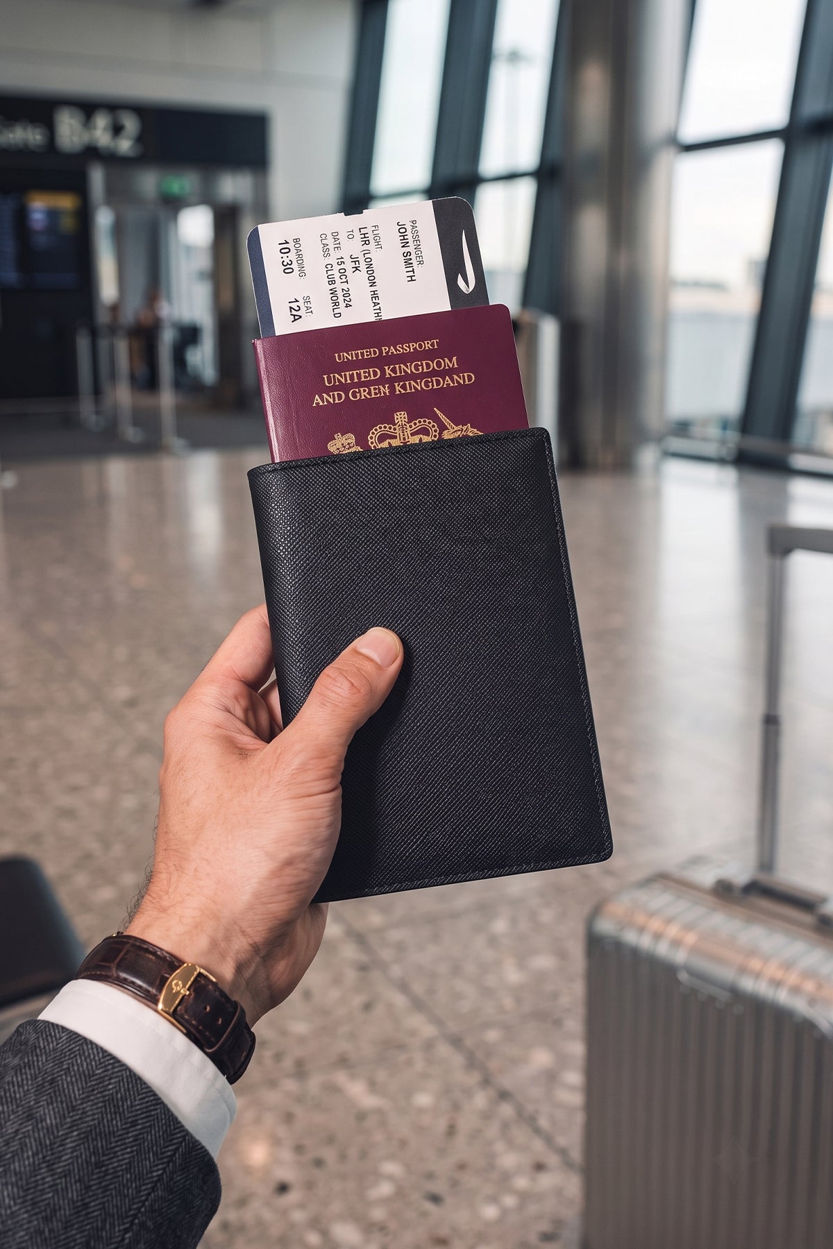Man holding Covent Black Passport Holder | Oswin Hyde