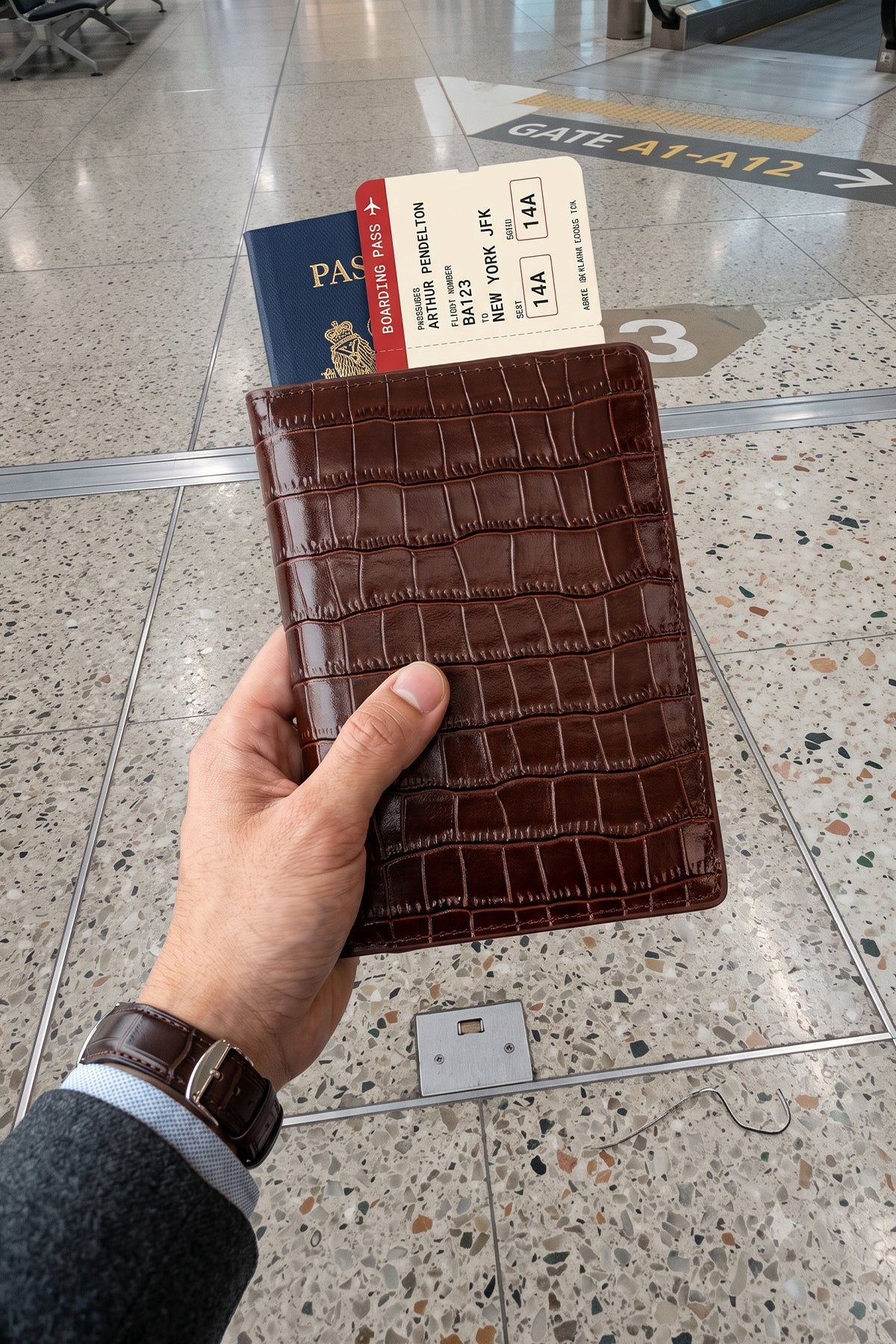 Man holding Covent Brown Croc Passport Holder | Oswin Hyde
