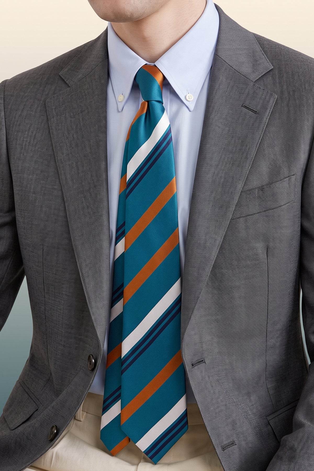 Man wearing Evan Teal tie with vintage stripe design, perfect for weddings, parties, and formal occasions.