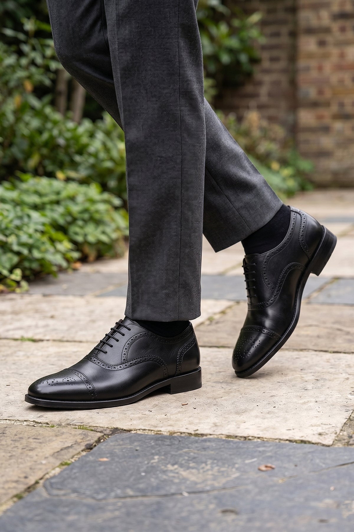 Westminster black leather Oxford brogue shoes for men, featuring a five-eyelet lace-up and classic toecap detail for a polished formal look.