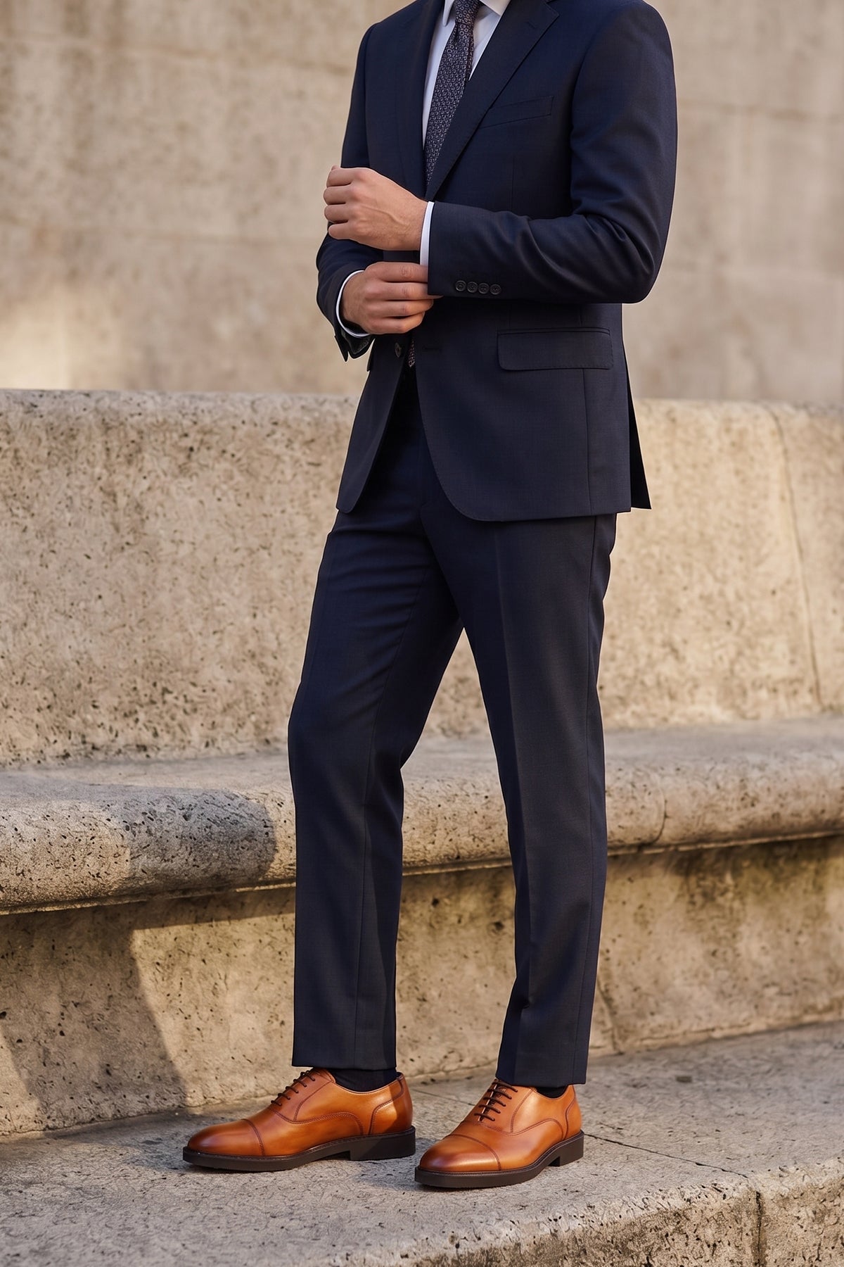 Model wearing Oswin Hyde Flint Tan, classic tan leather Oxford shoes with lace-up design, premium craftsmanship, breathable lining, and durable sole