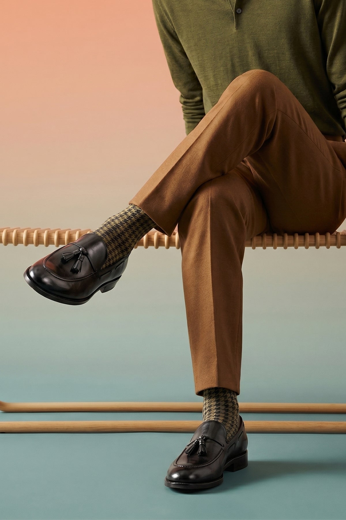 Model wearing Issac Black Leather Tassel Loafers for men with cushioned sole, premium finish, and timeless style ideal for formal wear and smart-casual outfits.