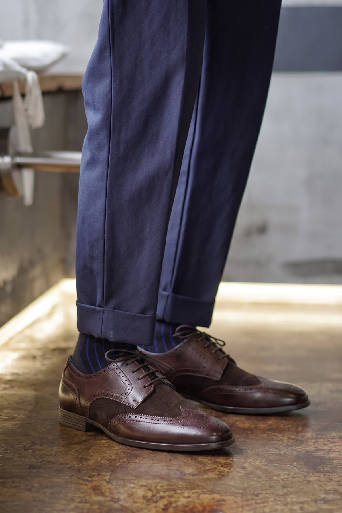 Model wearing Miller Brown Suede men’s leather and suede brogue shoes with wingtip detailing.