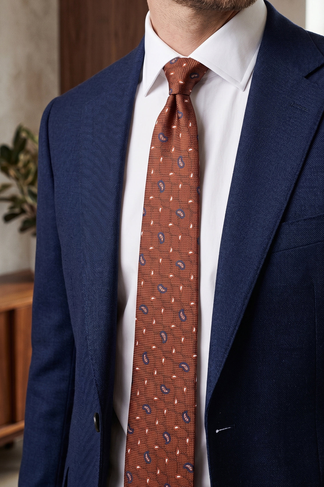Oswin Hyde Paisley Geometric Bronze tie for men, designed to add a unique touch to your wardrobe. The intricate paisley and geometric patterns, combined with a rich bronze colour.