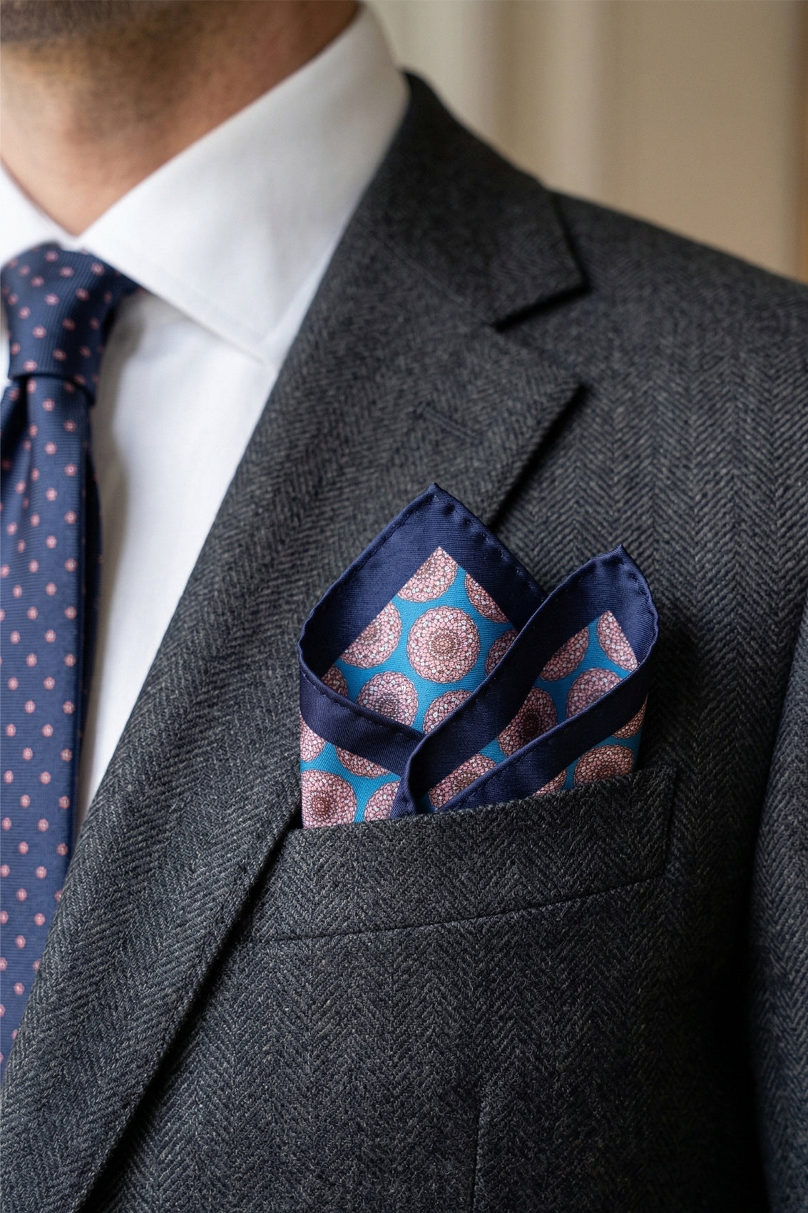 Men’s blue silk handkerchief with an intricate geometric pattern, perfect for weddings, formal occasions, or sophisticated smart dressing.