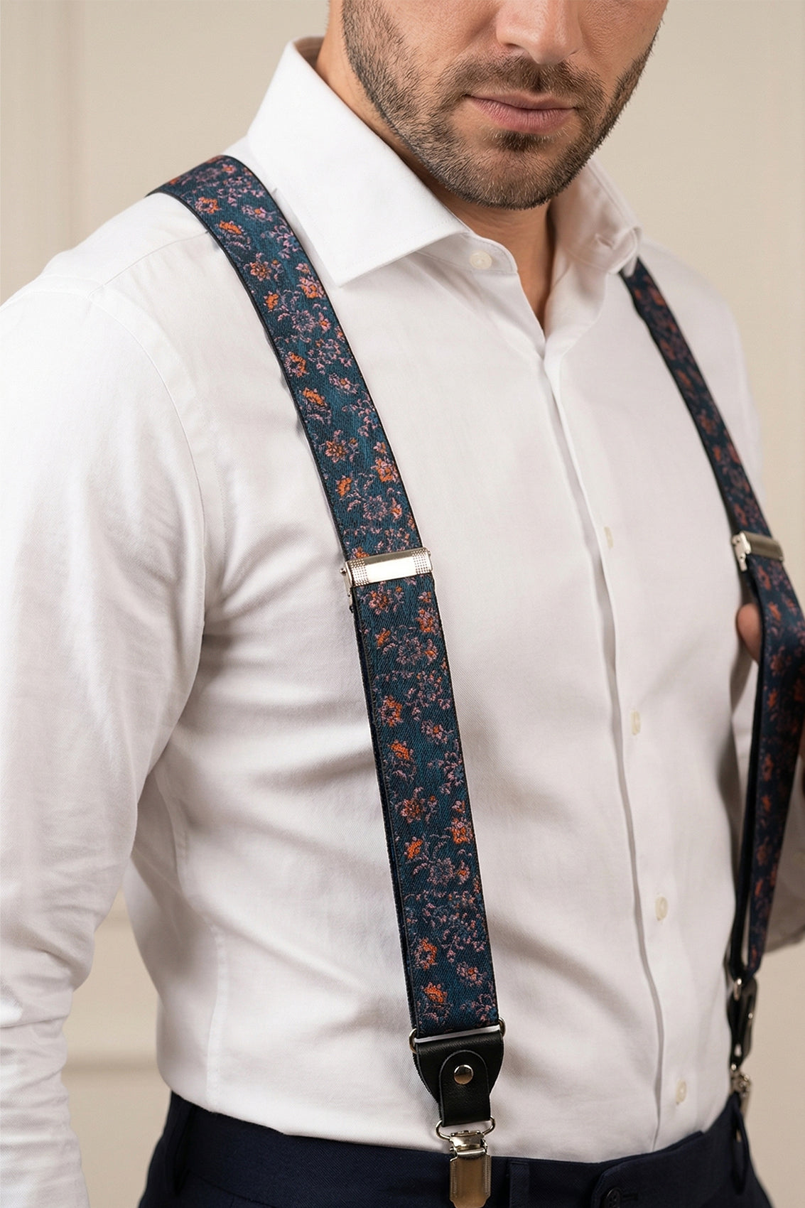 Men’s blue floral clip‑on braces and suspenders with elastic straps and metal clips, perfect for wedding, business, or refined casual wear.