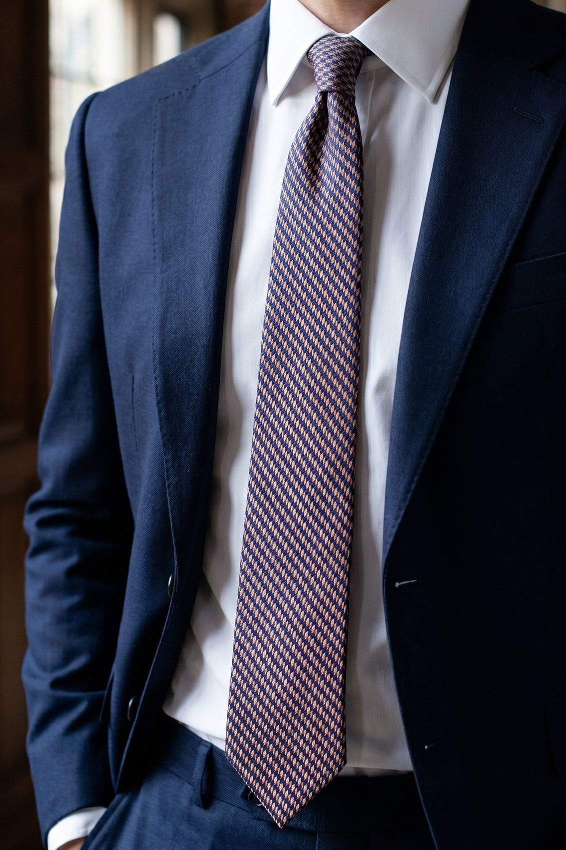 Luke Bronze/Navy tie with geometric pattern, perfect for weddings and special occasions.
