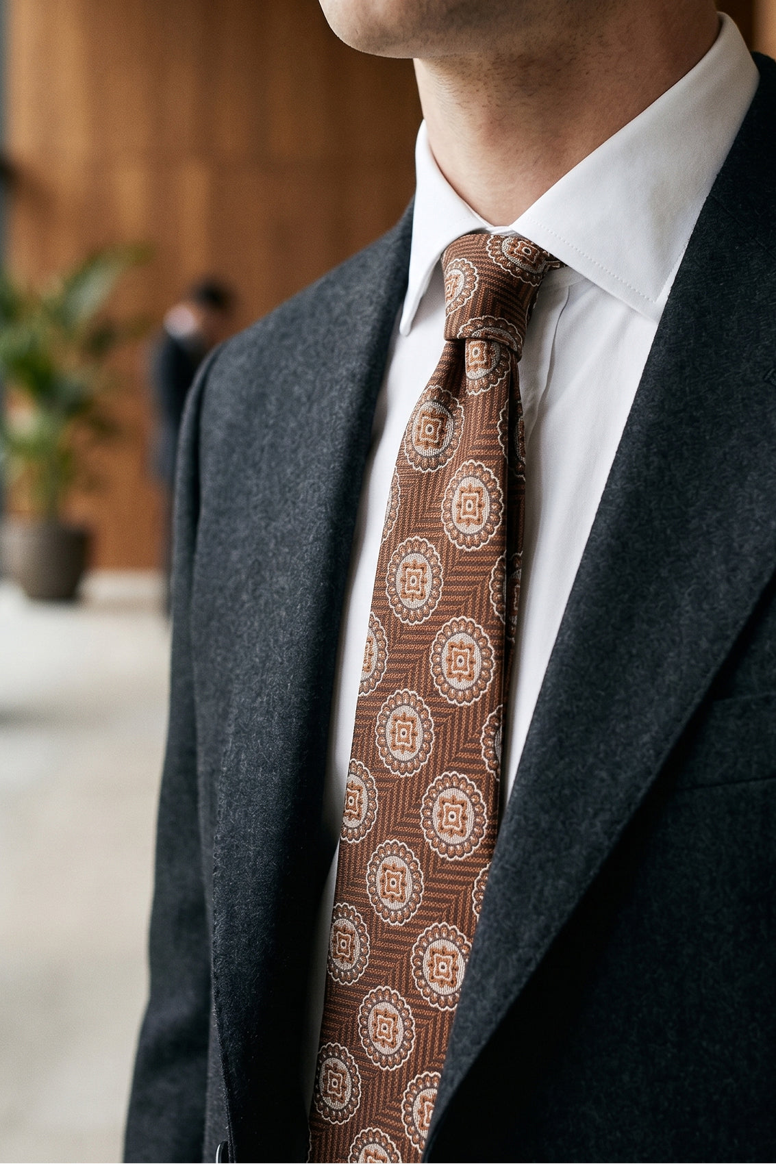 Brown Geometric Circles tie for men. Featuring a striking geometric circle pattern in rich brown